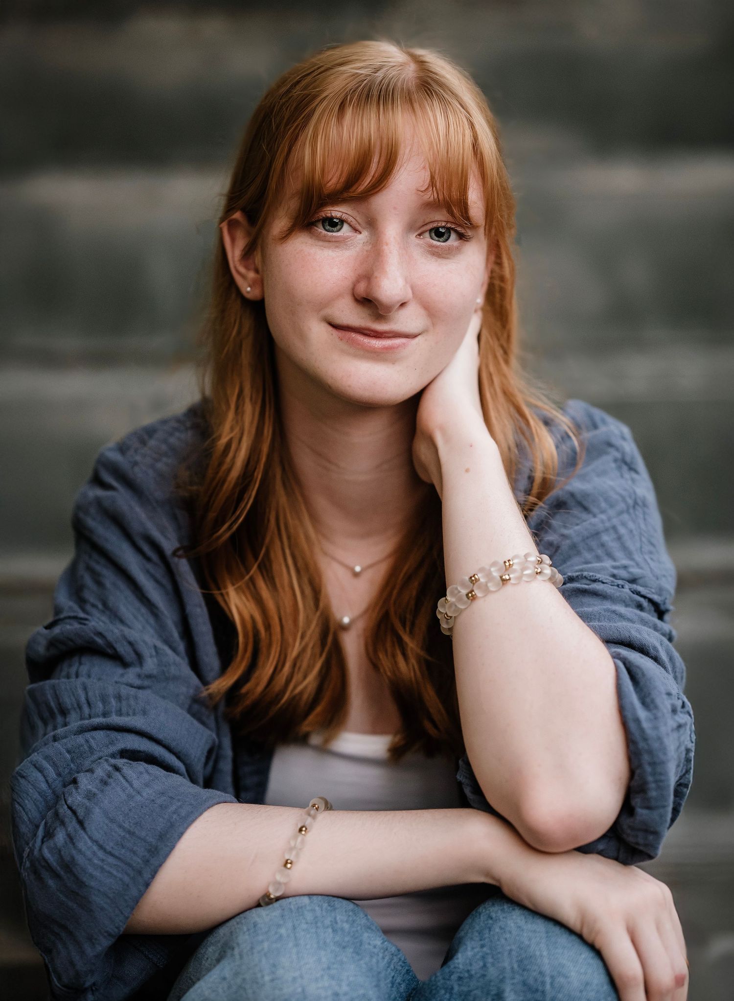 A person in a denim jacket poses outdoors in a series of casual portrait shots showing different expressions.