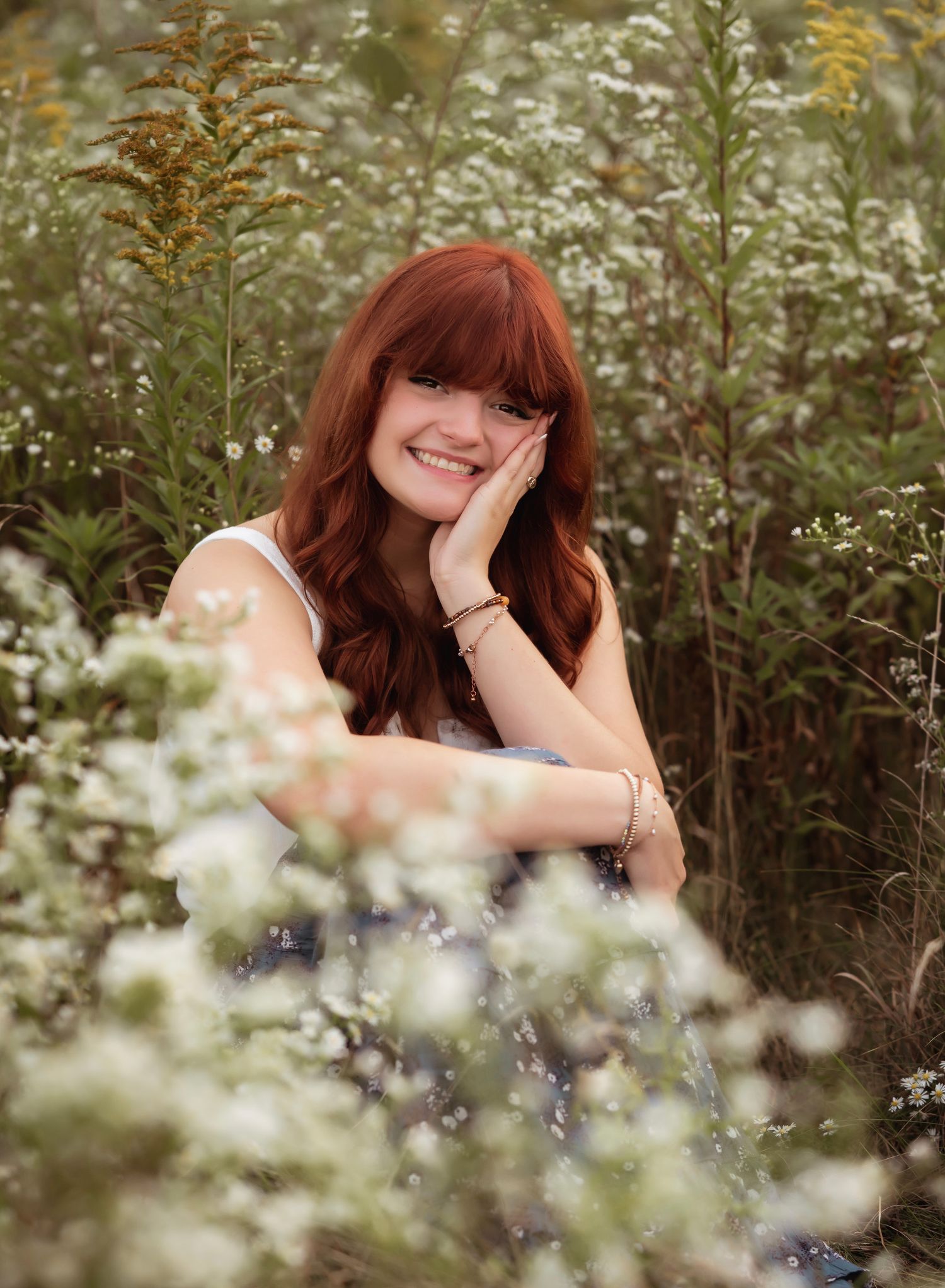 A joyful moment captured in a wildflower meadow with white blooms and natural golden lighting.