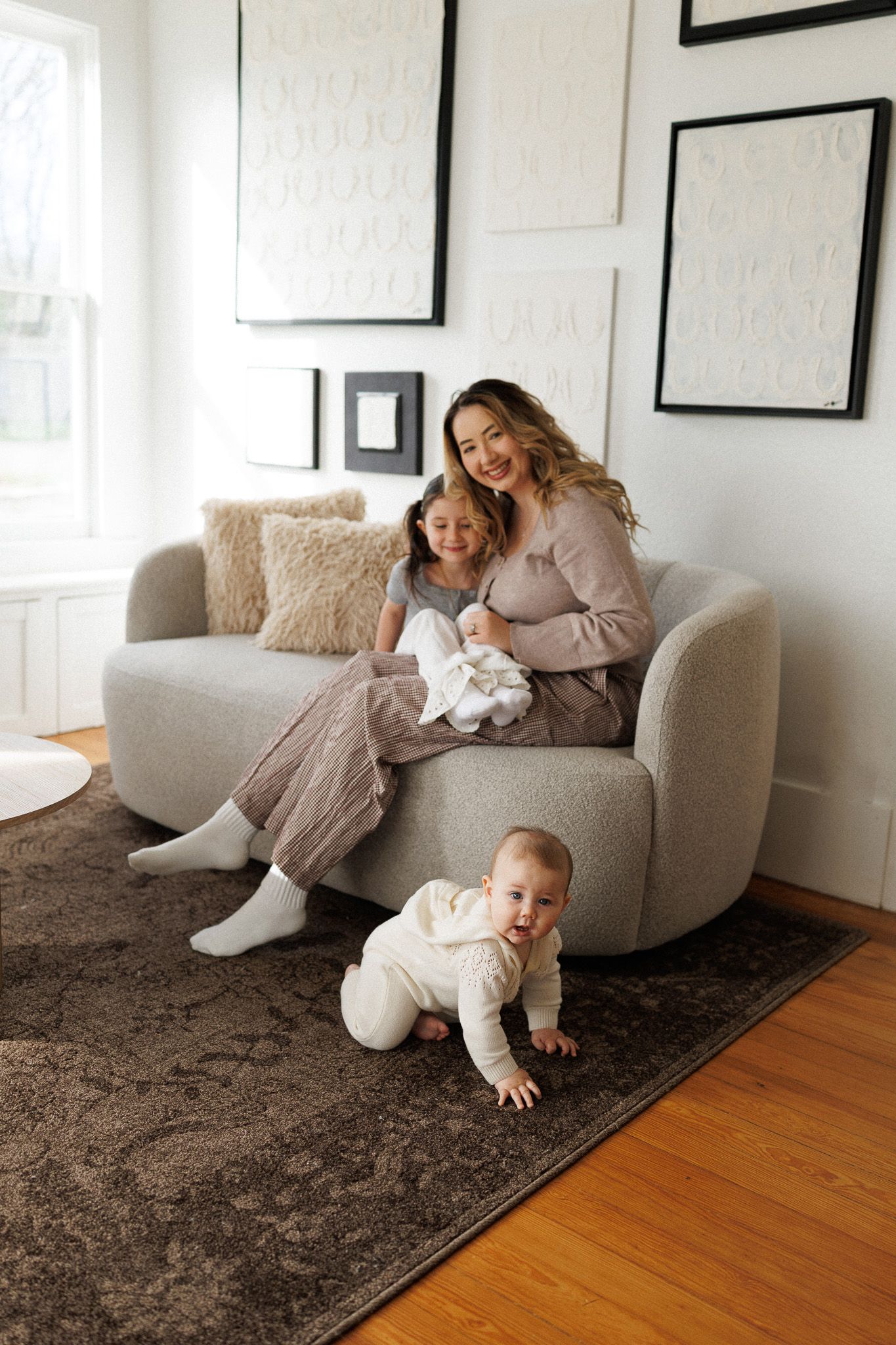 A sequence of playful moments on a cozy gray couch and brown rug shows a parent and child sharing joyful interactions.
