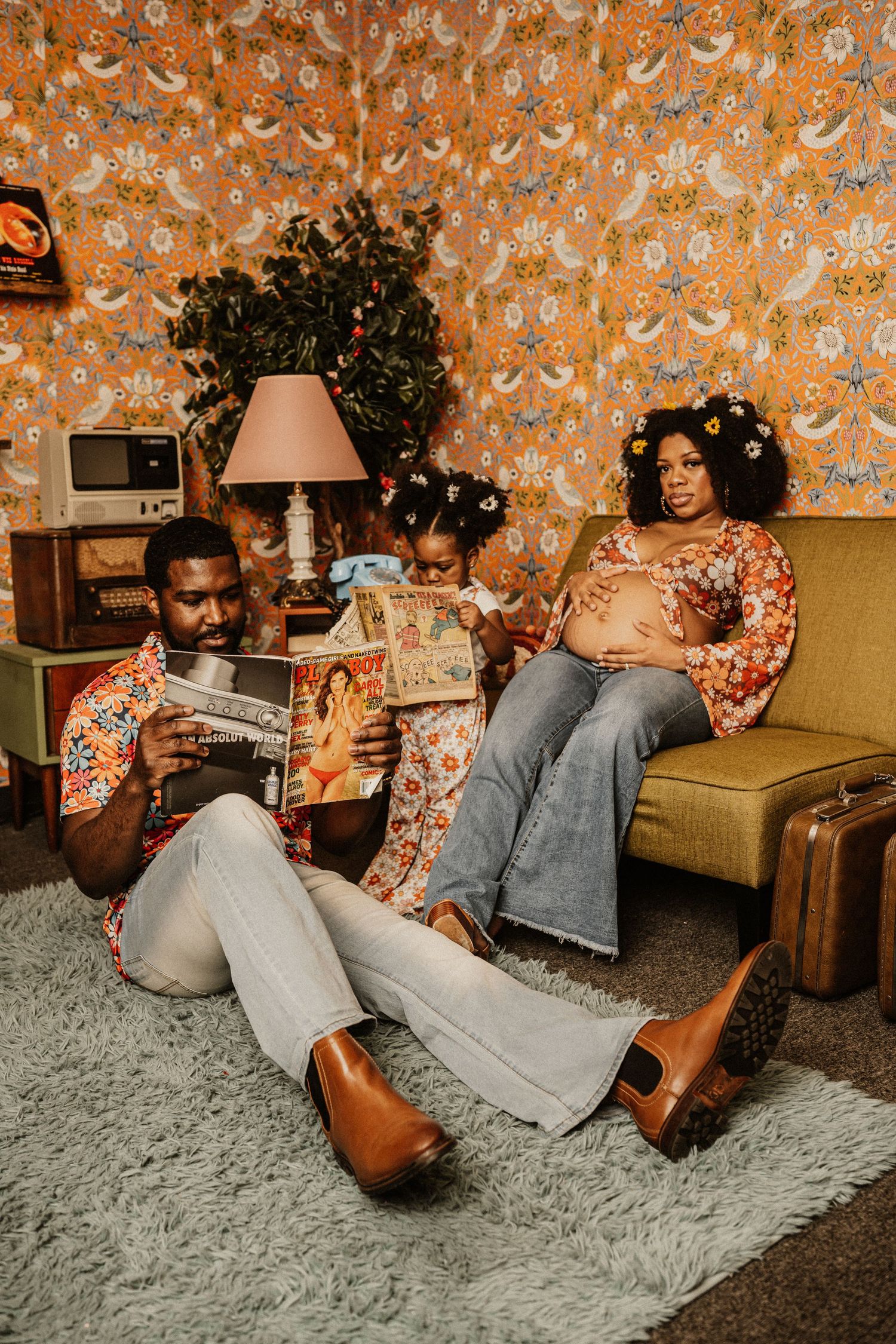 Retro-styled photo series with orange floral wallpaper and mustard couch showing intimate lifestyle moments.