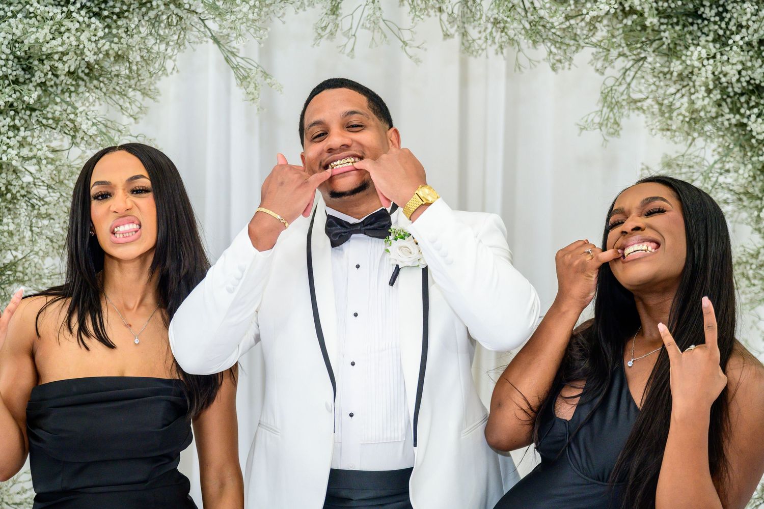 Wedding party members share candid laughing moments in formal attire.