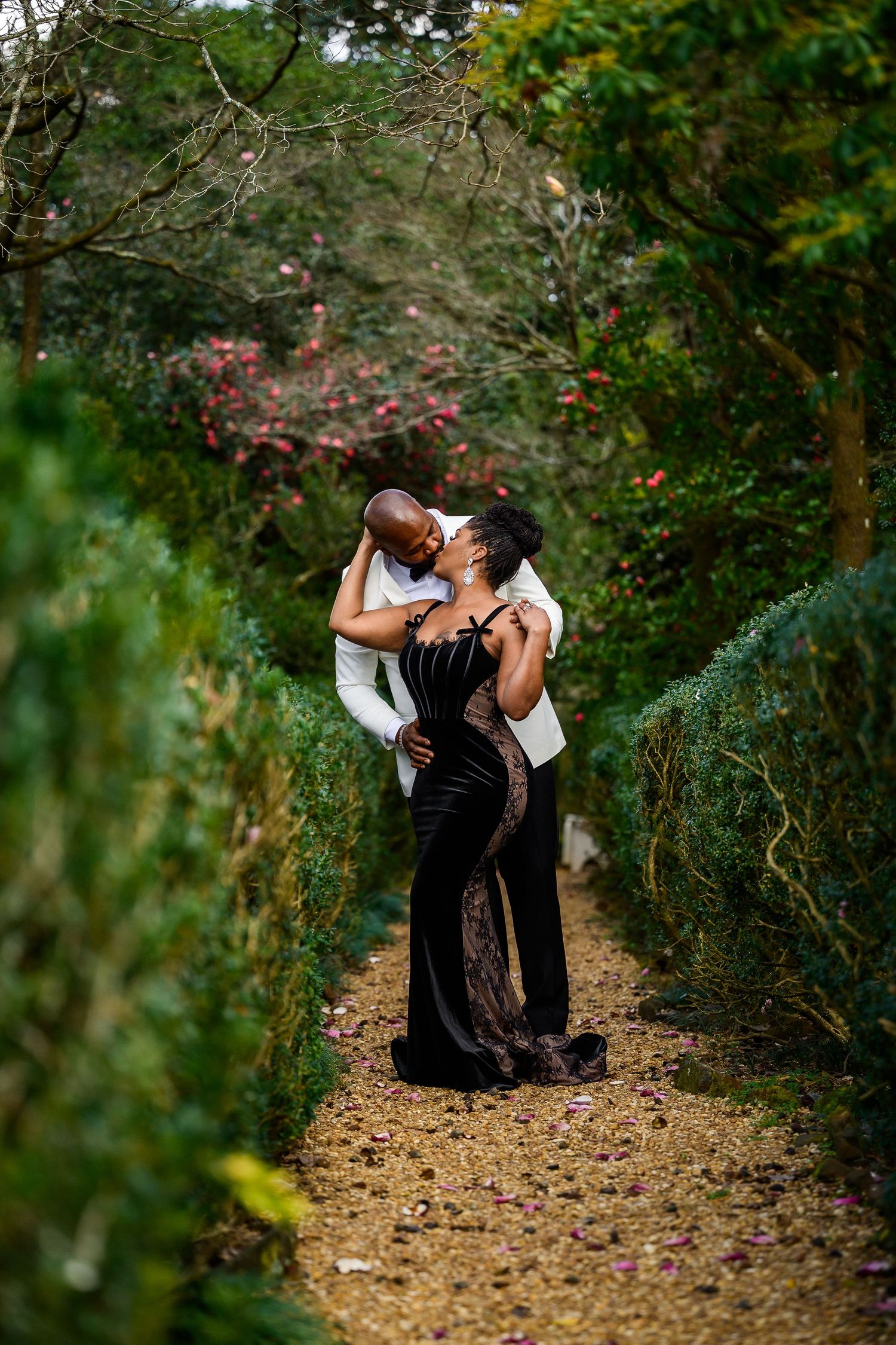 Elegant dance poses captured on a wooded path surrounded by vibrant green foliage.