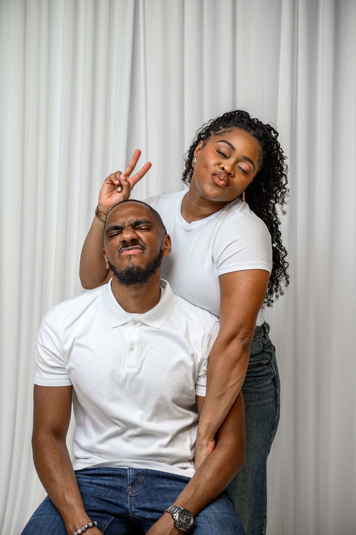 A playful photo series showing someone in white shirt and jeans making expressive poses against a white background.