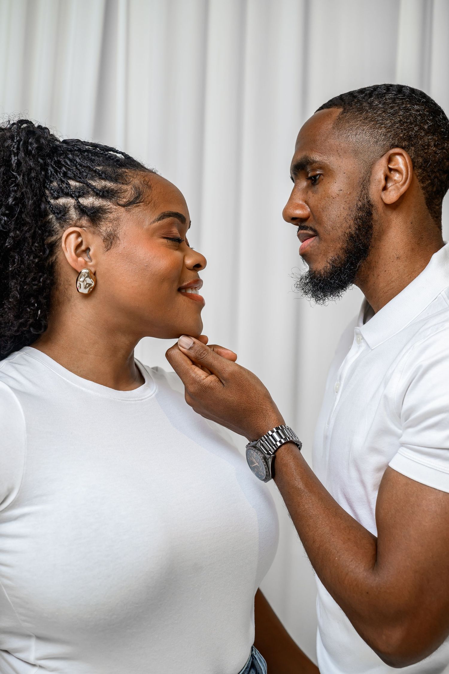 A couple in white shirts share intimate moments in a sequence of romantic poses against a white background.