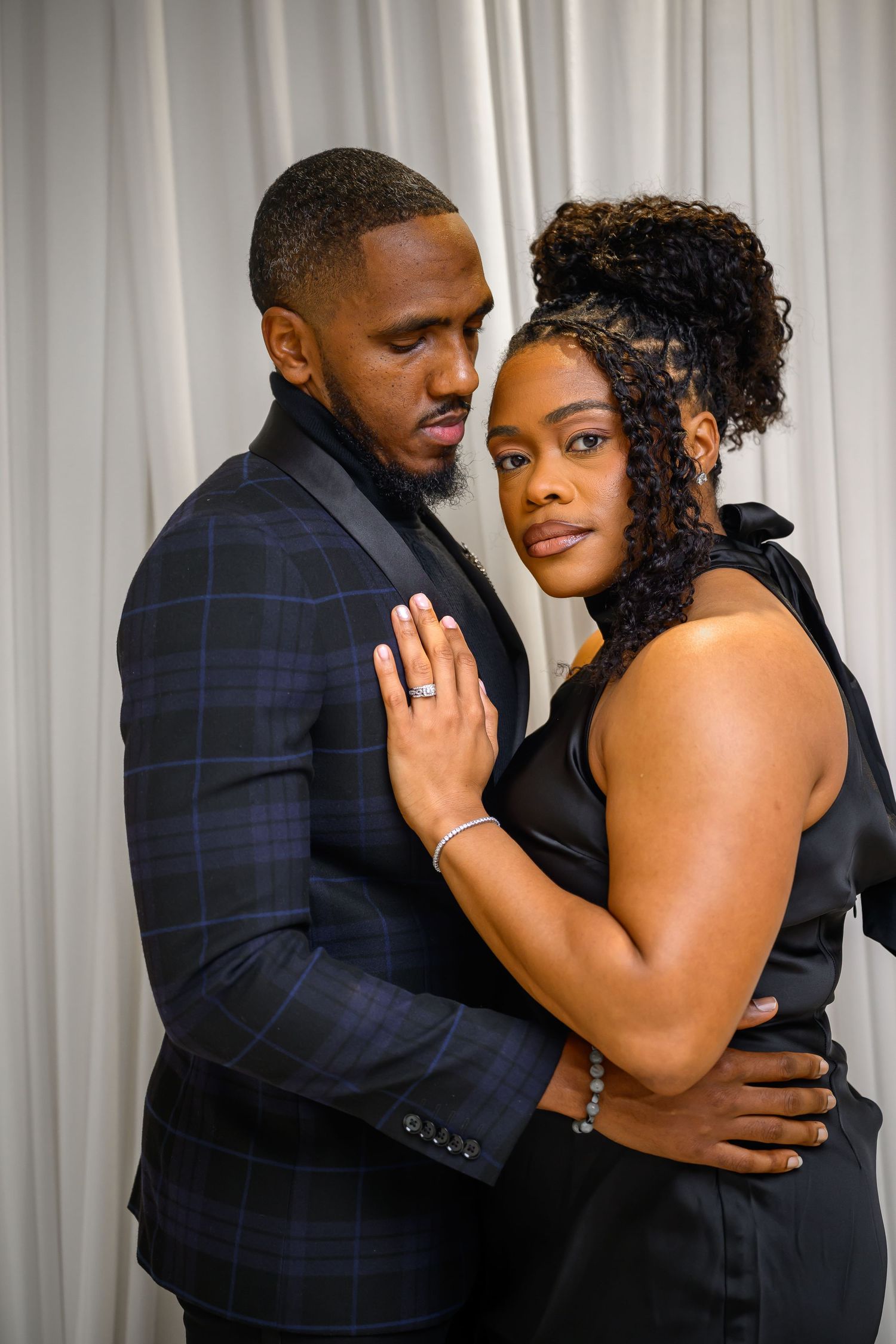 A romantic couple in formal attire embrace and dance together in a series of three connected photos.