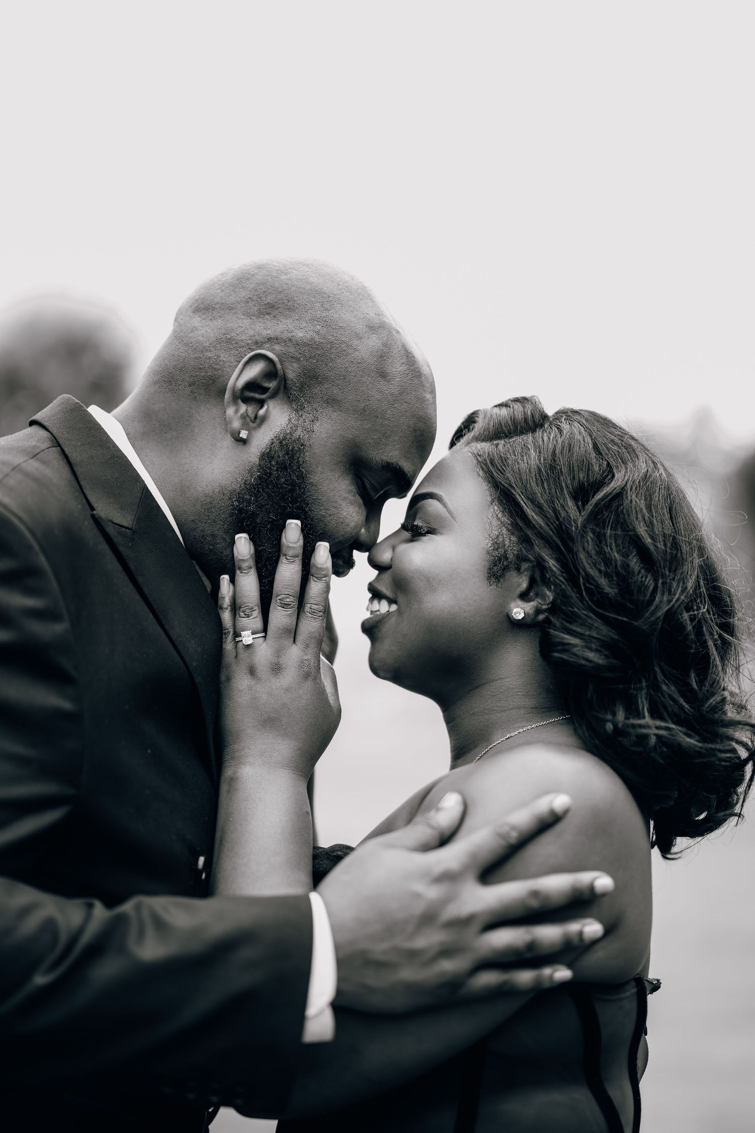 Intimate black and white portrait series capturing romantic moments between a couple.