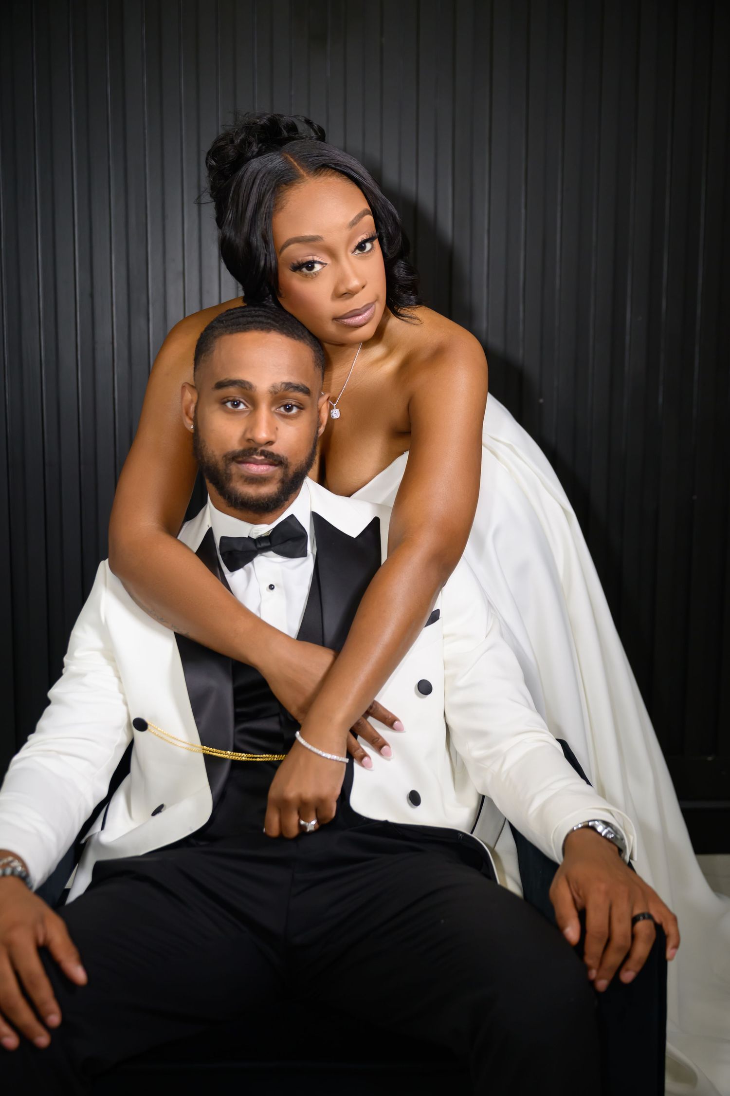 A romantic wedding photoshoot series showing a couple in formal attire posing against a dark background.