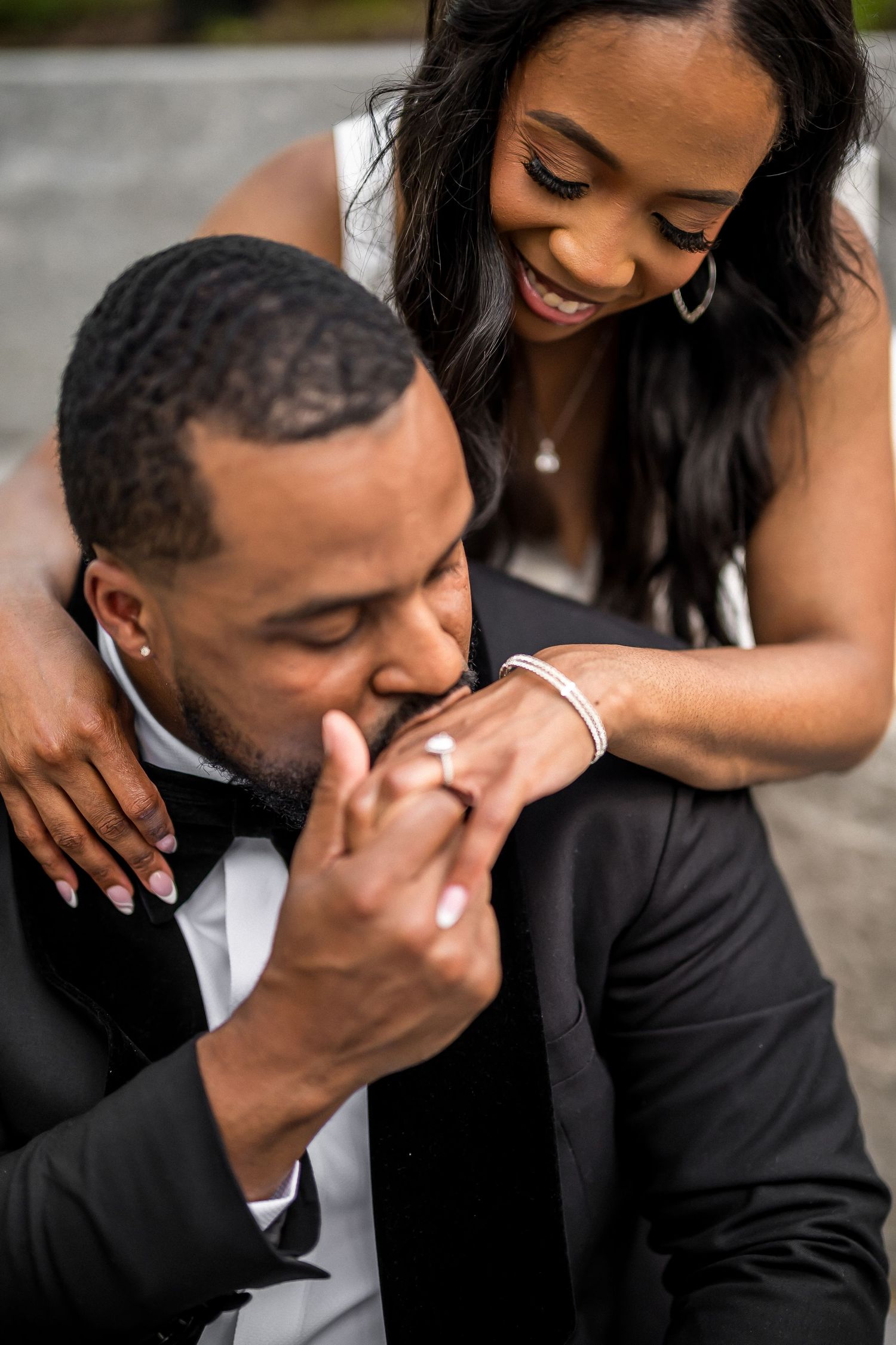Intimate black and white portrait of couple sharing tender moment.
