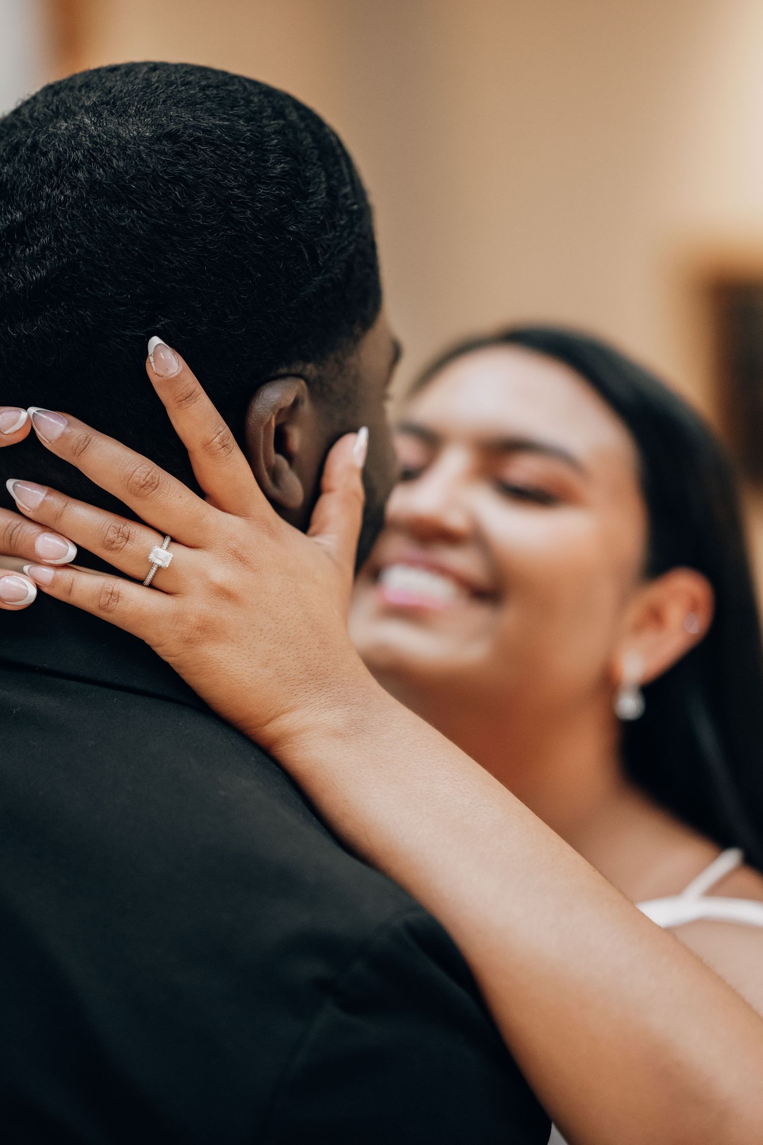 Tender embrace captured in intimate wedding portrait.