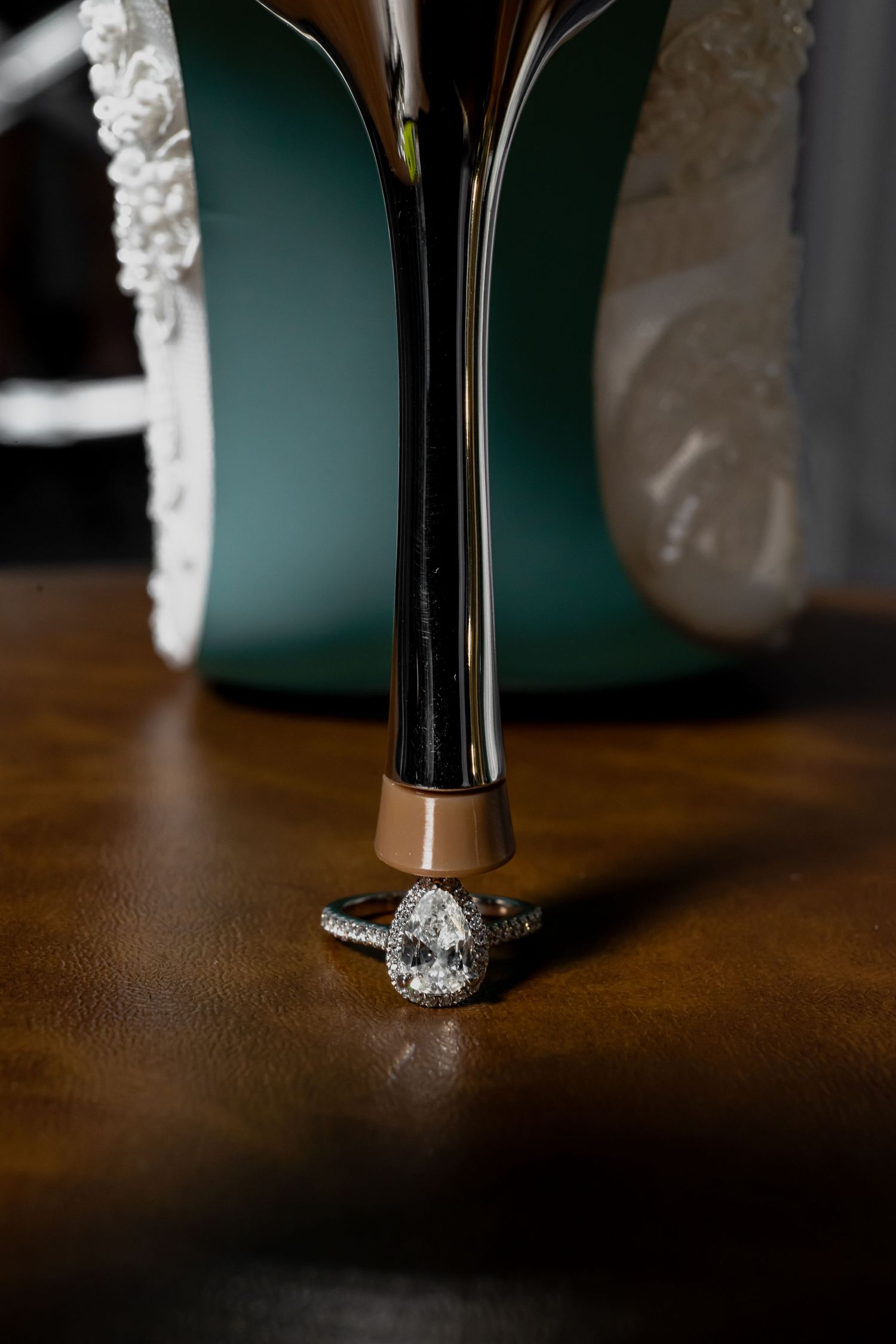 Close-up detail shots of an elegant crystal-embellished bridal shoe.
