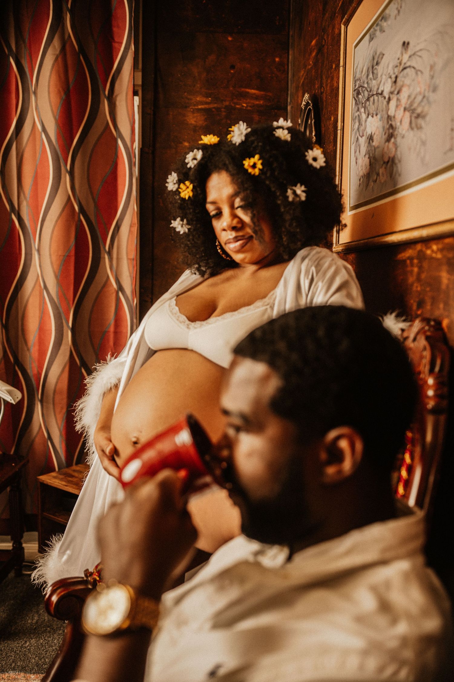 Intimate family lifestyle session with vintage decor and warm lighting.