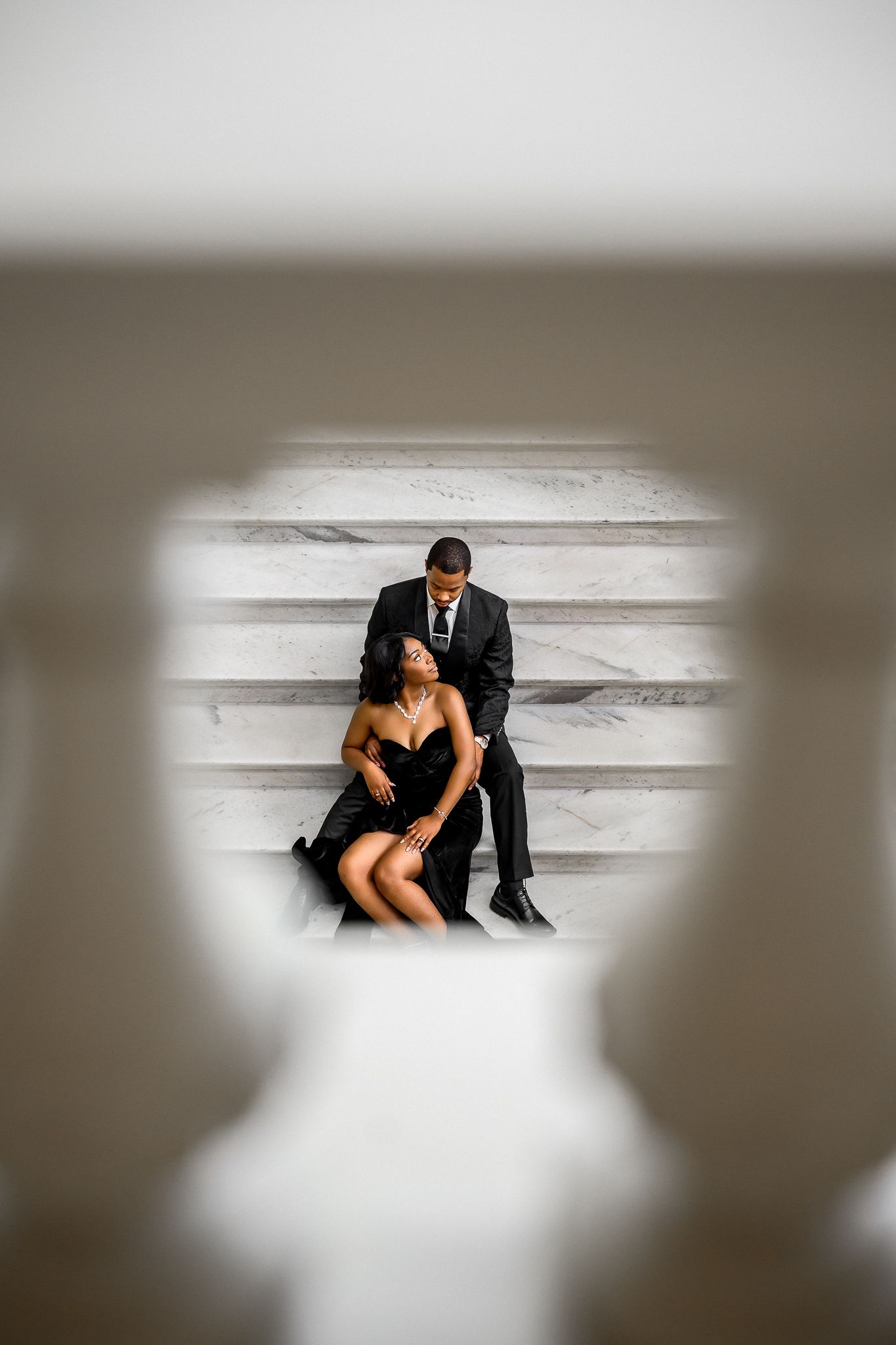 Dreamy photoshoot sequence with soft focus effects showing couple on marble steps.