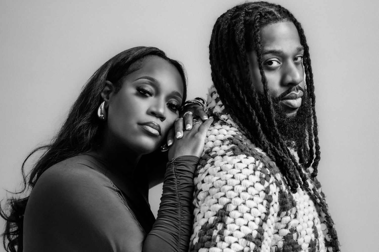 Black and white maternity photography session showing intimate couple poses.