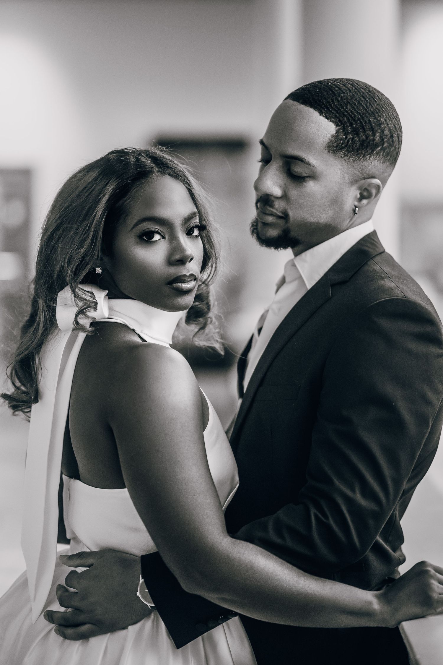 Intimate portrait sequence of a couple in formal attire against a light background.