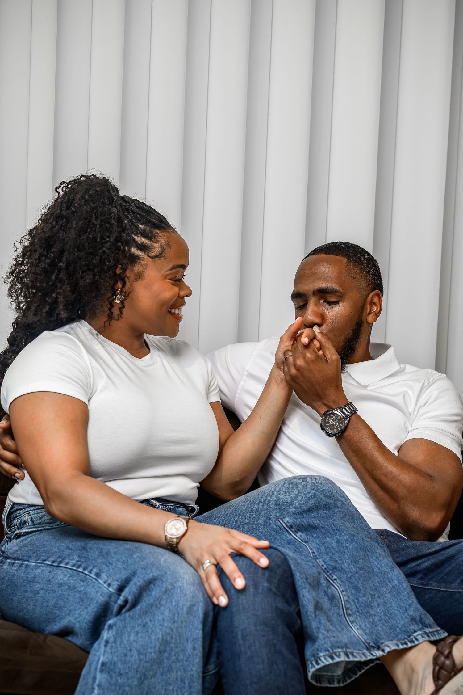 A series of photos showing people in white shirts and jeans laughing together while relaxing on a couch.