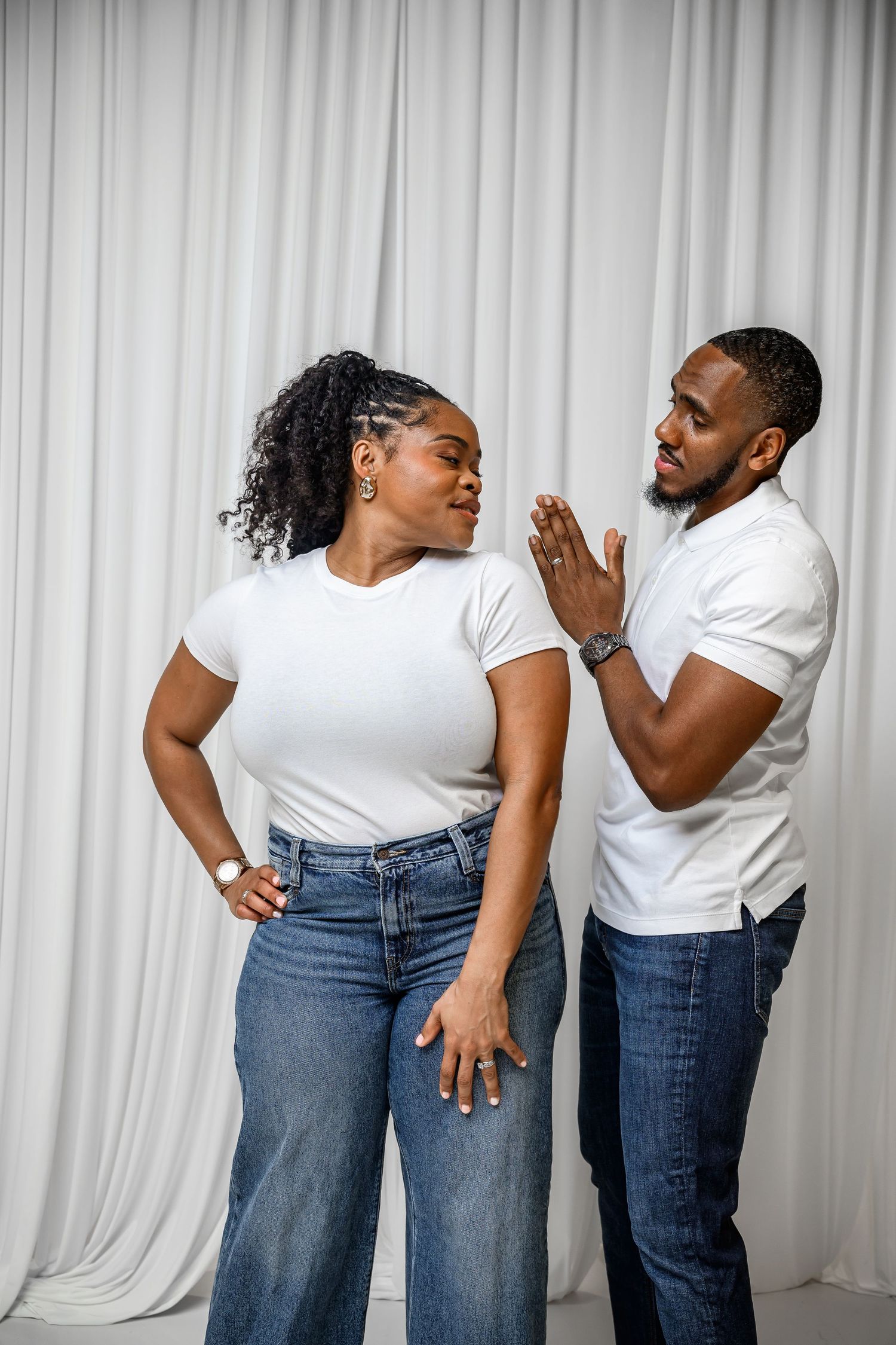 Multiple photos showing the same outfit of white t-shirt and blue jeans in different dynamic poses against a white backdrop.