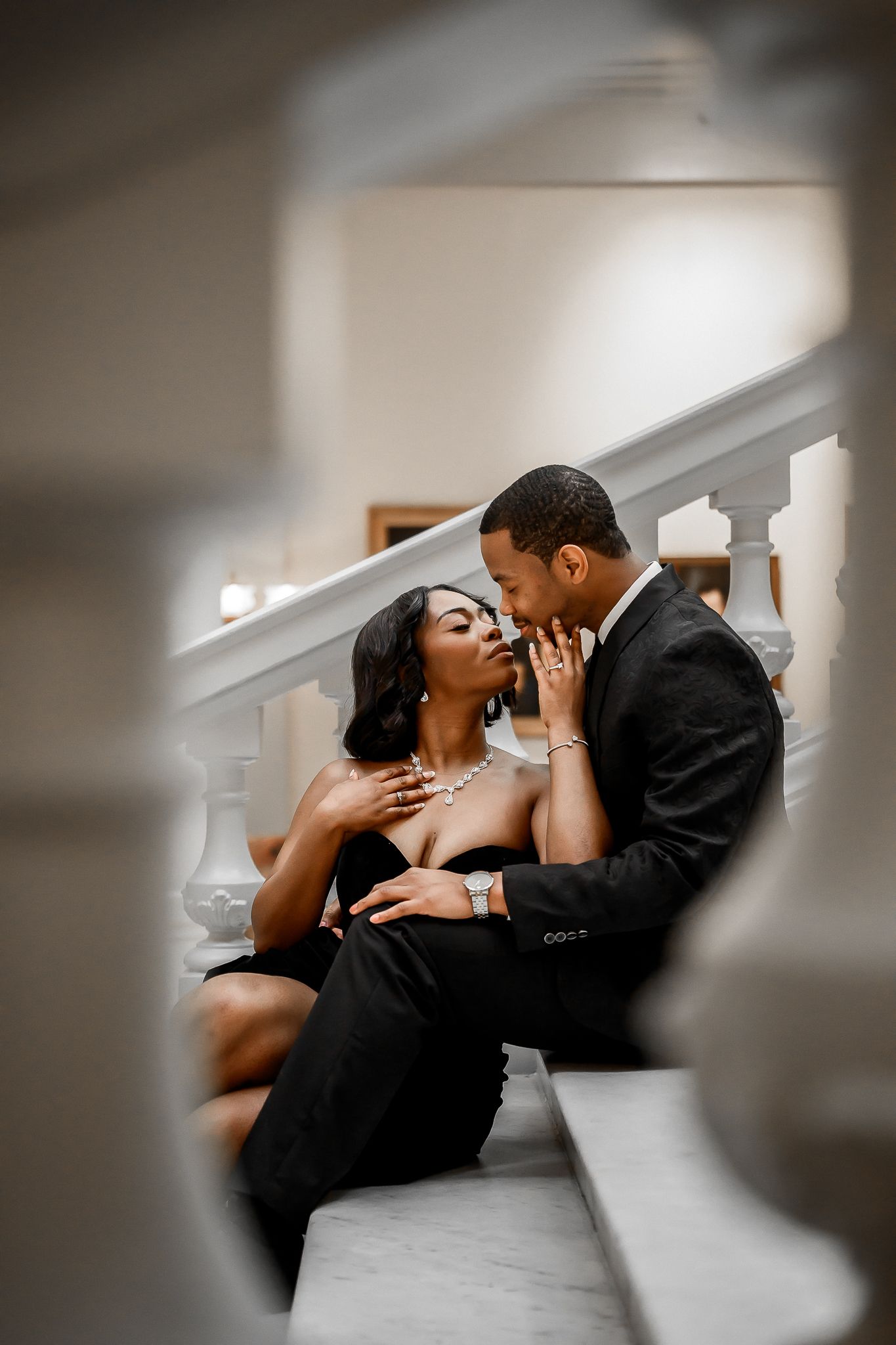 Romantic couple sharing intimate moments in a series of artistic black and white photographs.