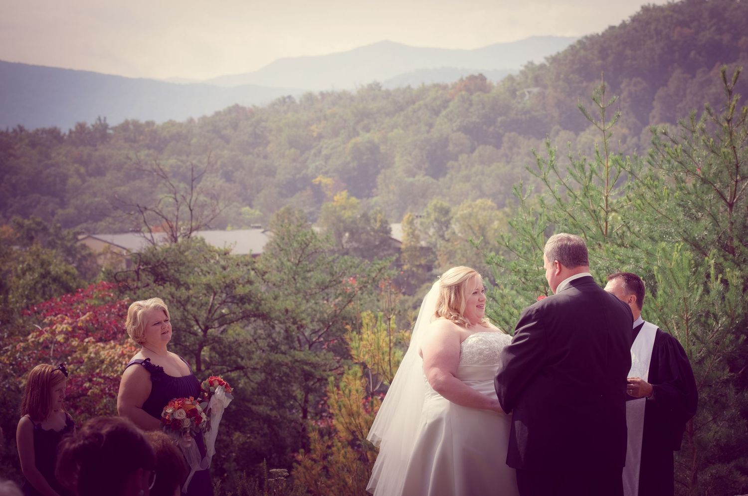 townsend tn wedding photographers portrait of wedding ceremony against the Great Smoky Mountains backdrop in Tennessee.