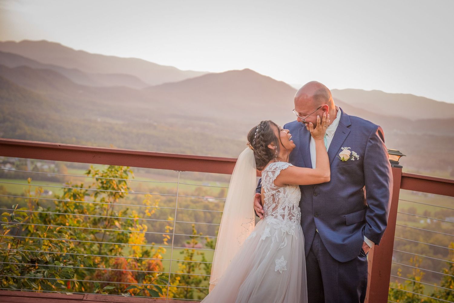 A romantic sunset moment at a scenic overlook with mountains in the background by Gatlinburg Wedding Photographers.
