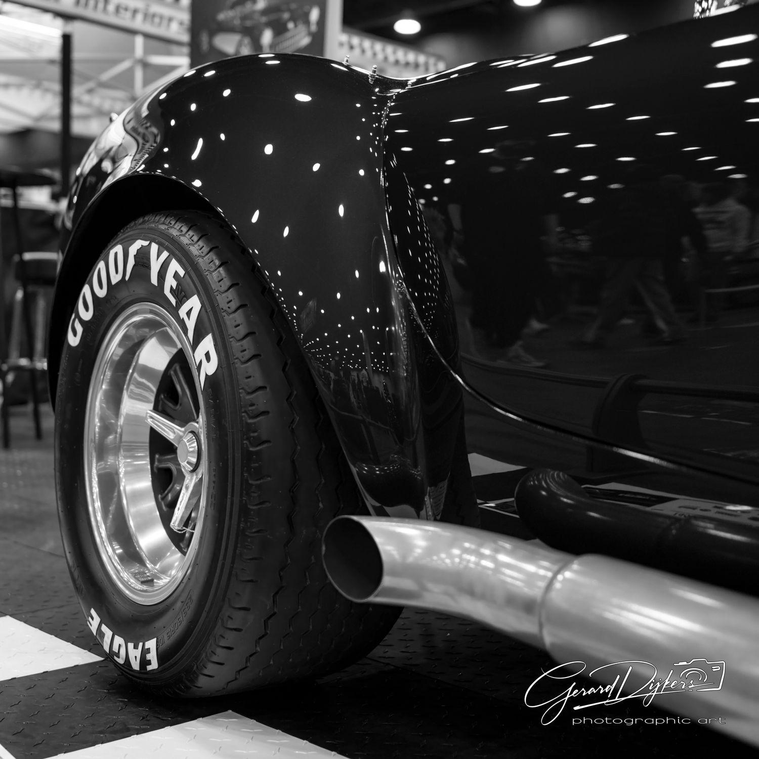 Black and white detail shots of classic car wheels and tires showcasing custom rims and wide racing tires.