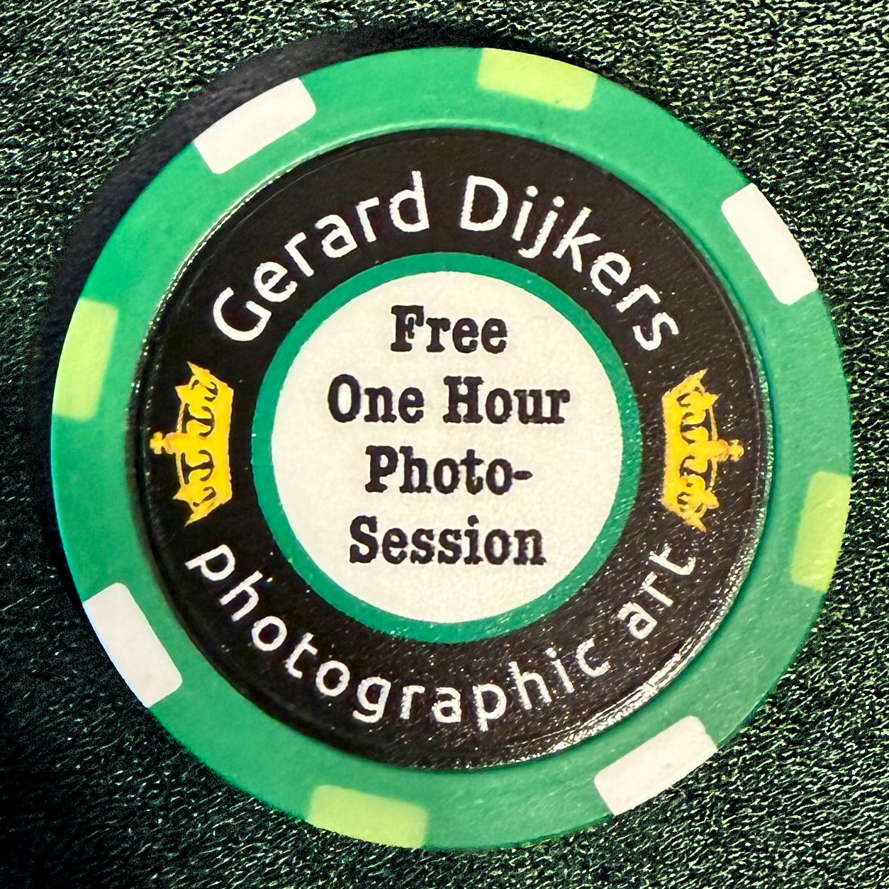 Green casino chip for Gerard Dijkers Photographic Art offering a free one-hour photo session.