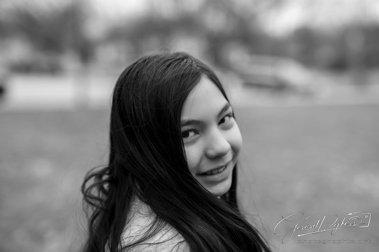 A series of black and white portraits showing different expressions and angles in a collage format.