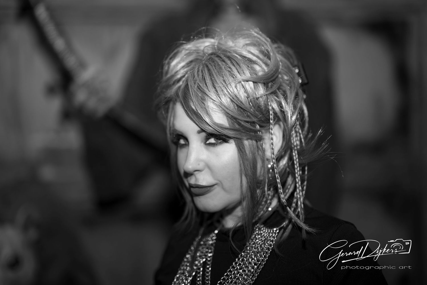 Black and white artistic portraits showing a glamorous style with dramatic lighting and makeup.