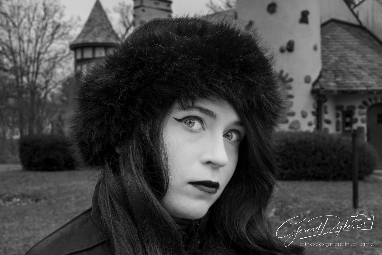 A black and white photo series showing five portraits of a person with dark lipstick and vintage styling.