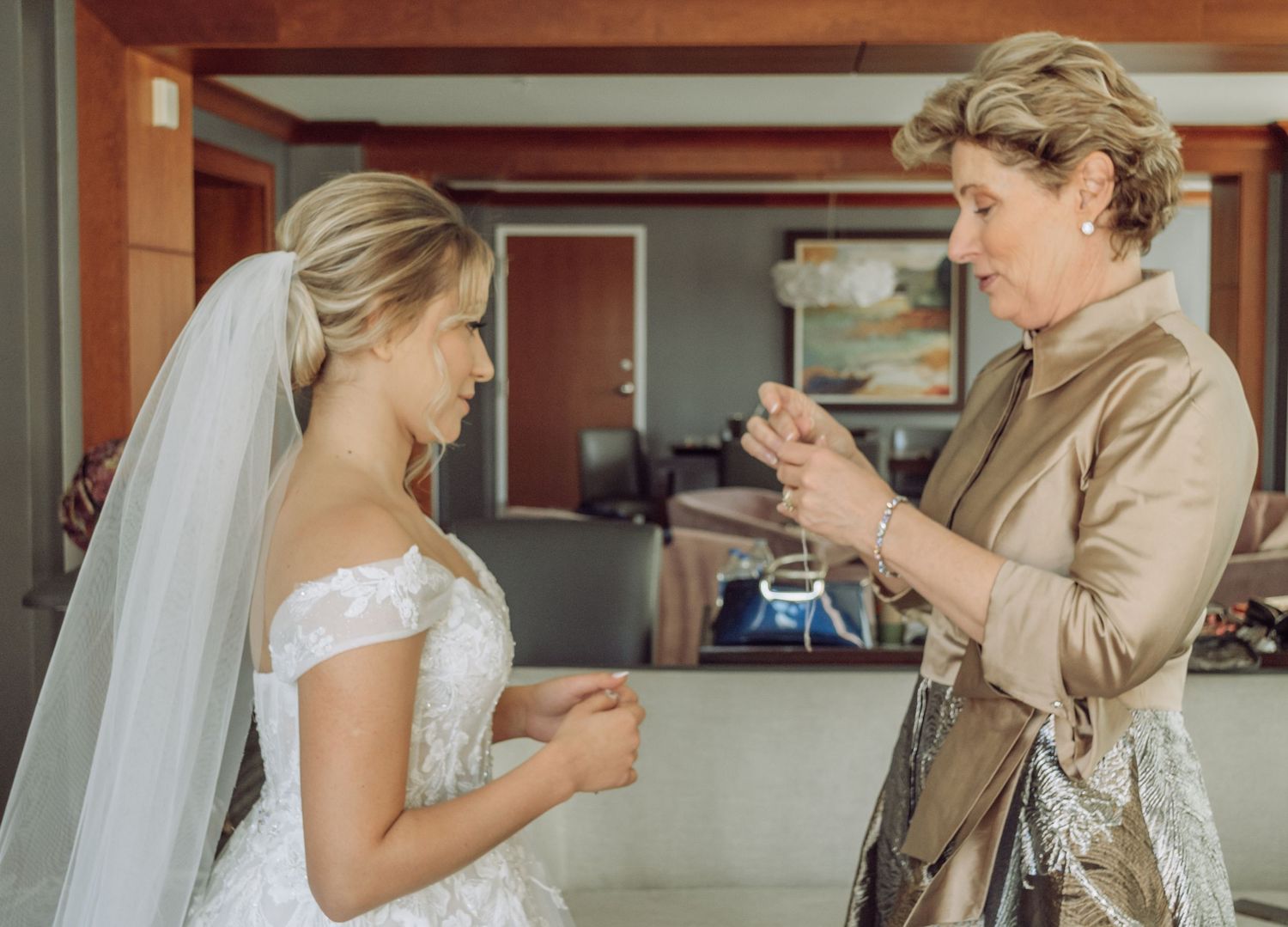 A first look wedding moment captured in a rustic wooden interior with natural lighting.
