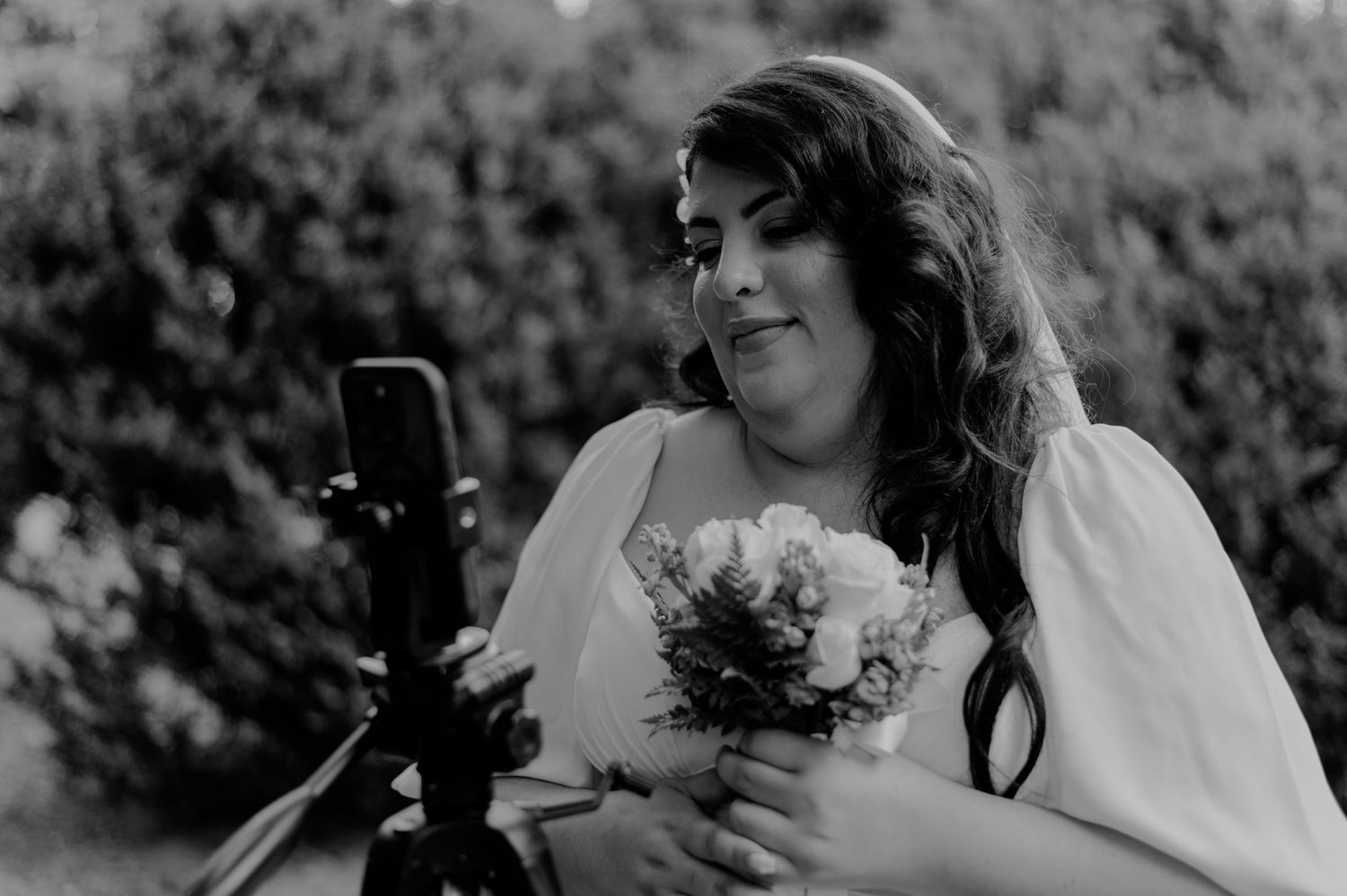 A black and white collage of wedding photography moments showing candid expressions and romantic interactions between the couple.