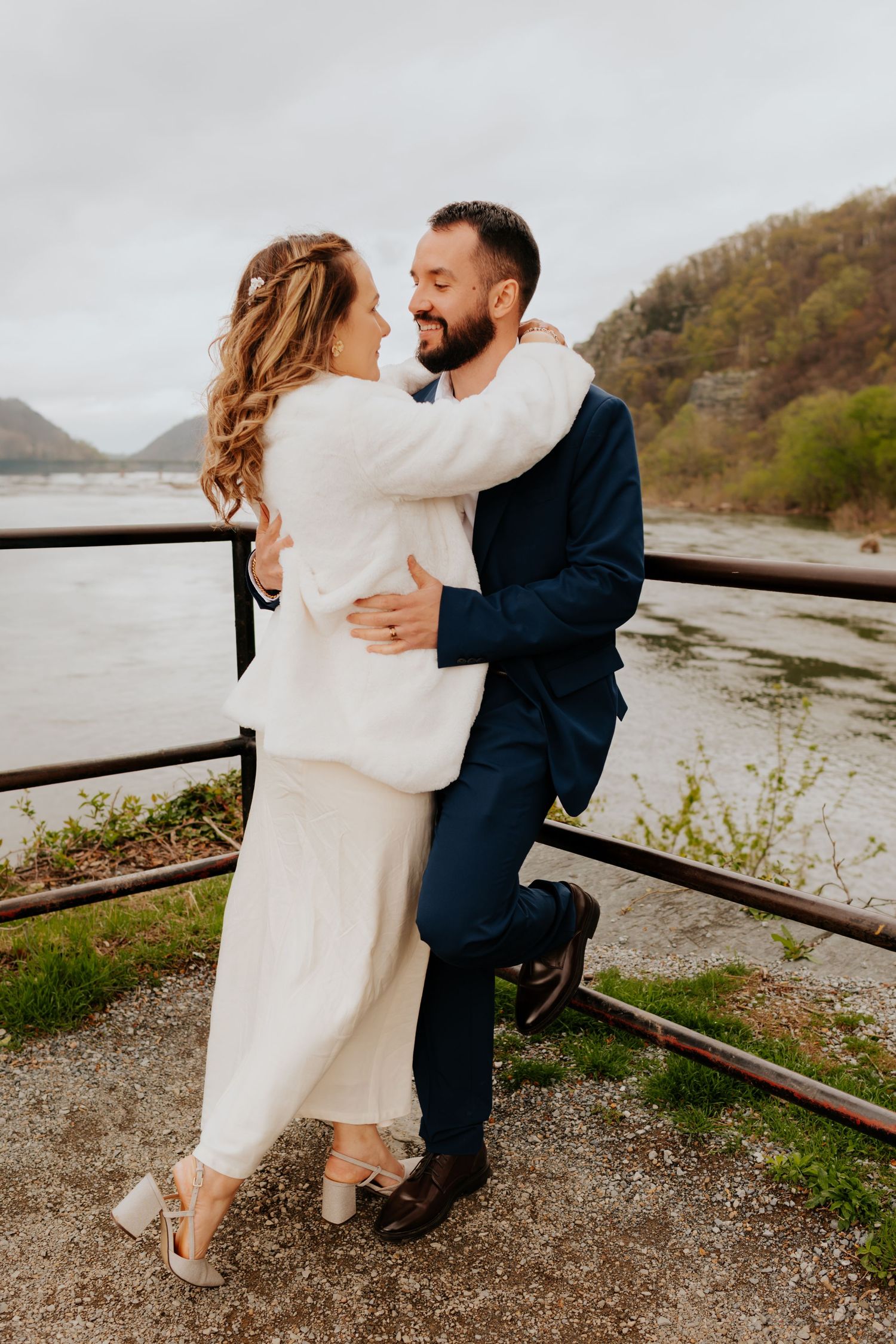 A romantic engagement photo sequence showing a couple embracing near a coastal beach with mountains in the background.