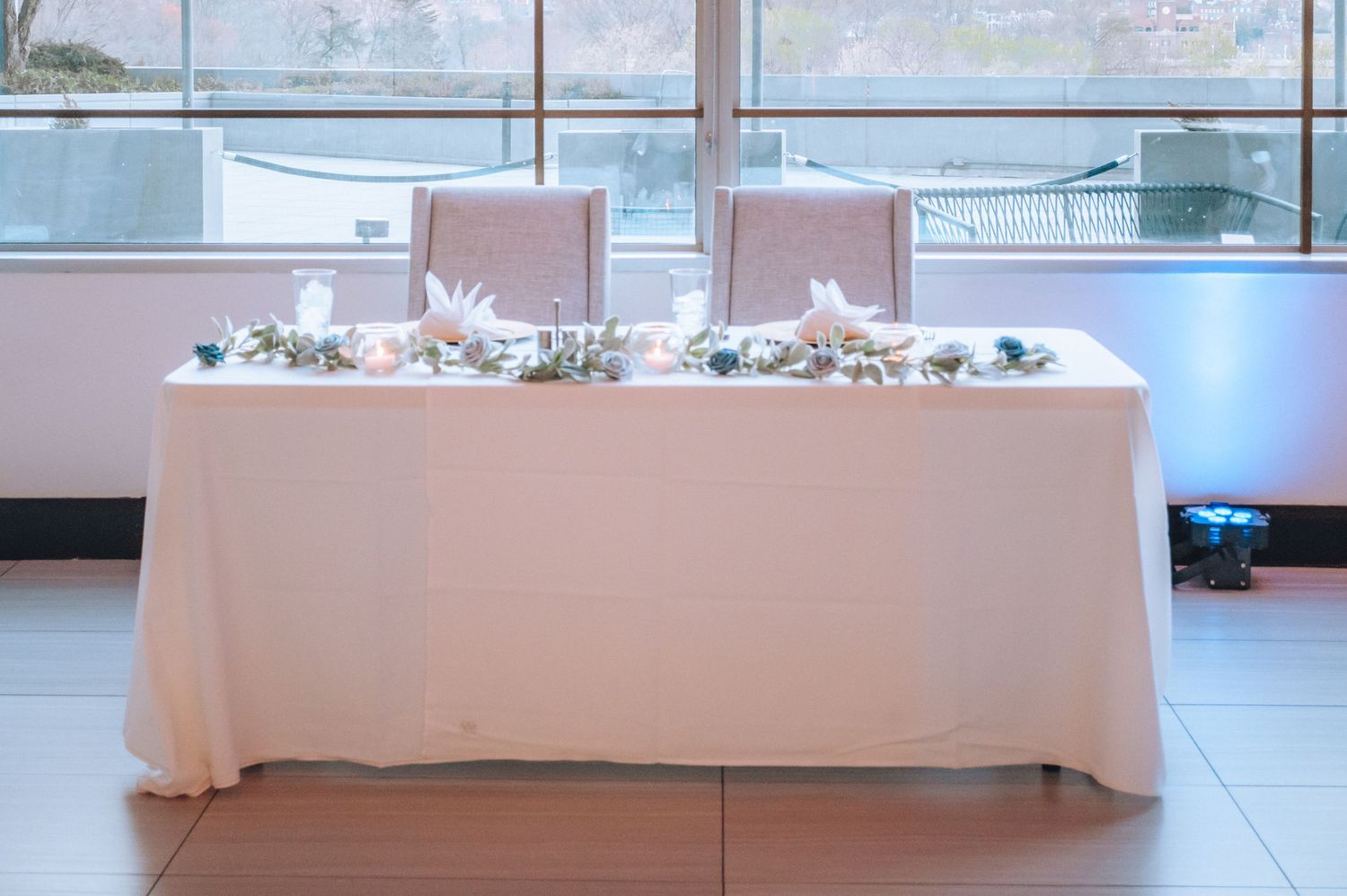 A long horizontal white bench seat cushion is shown against a plain background.