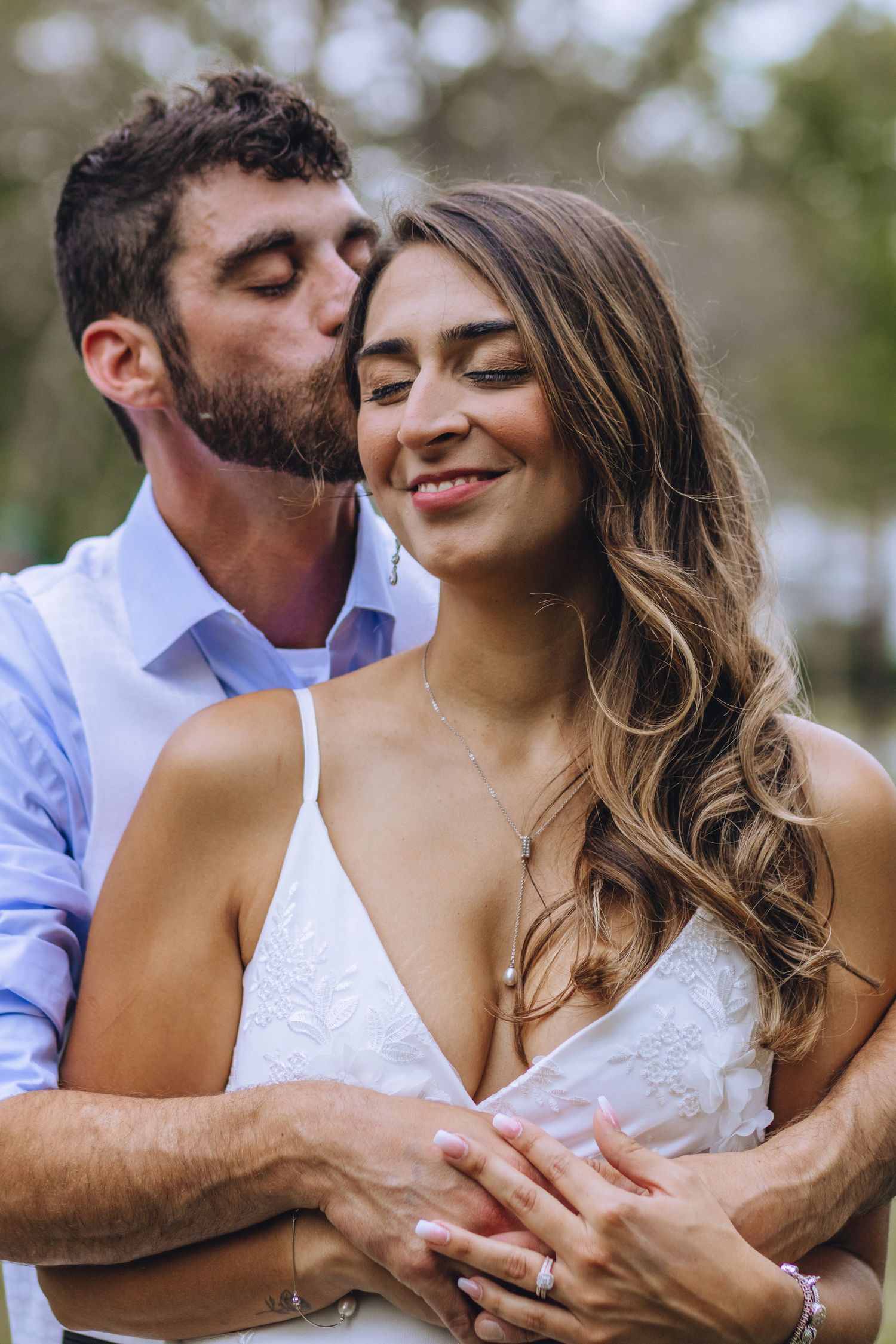 A romantic couples wedding photo sequence showing tender embraces and smiles together in natural lighting.