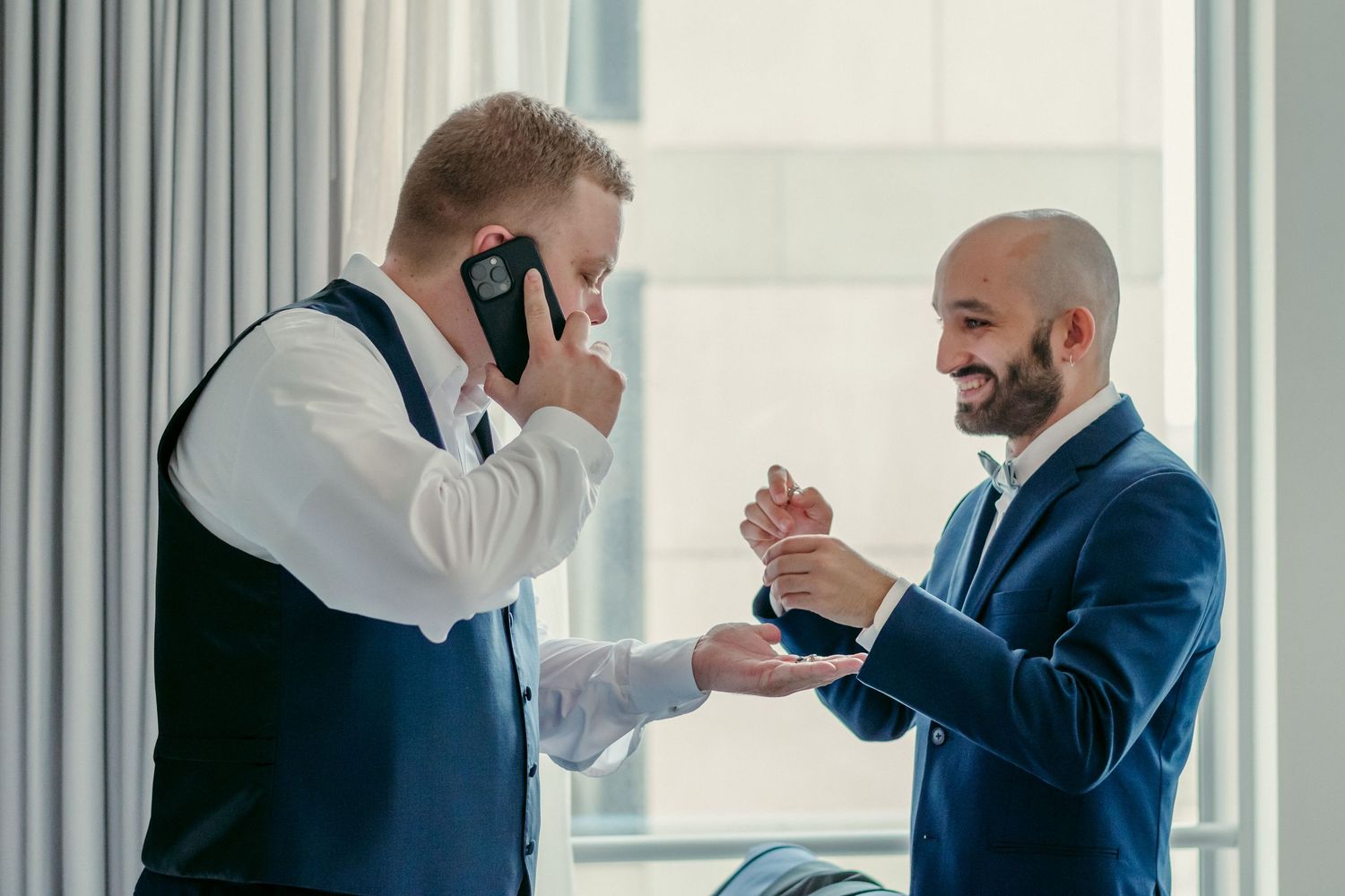 Business people wearing masks pass through an office hallway while practicing social distancing protocols.