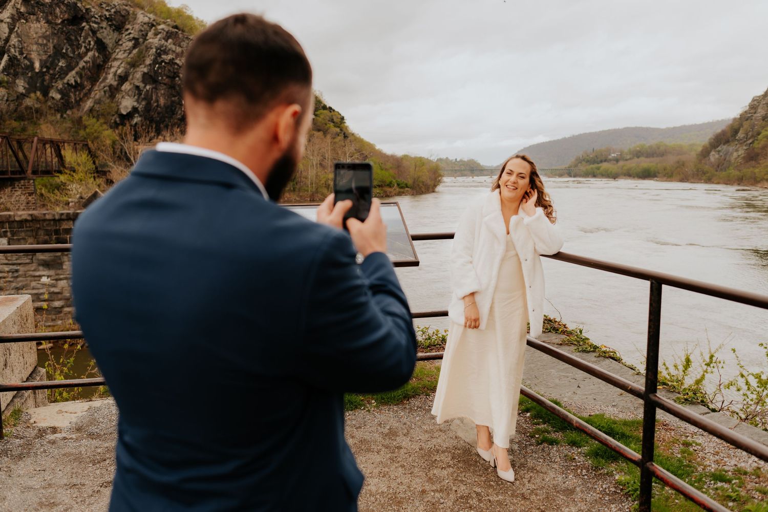 A sequence of wedding photos captured at a scenic riverside location with rustic railings and natural mountain landscapes.