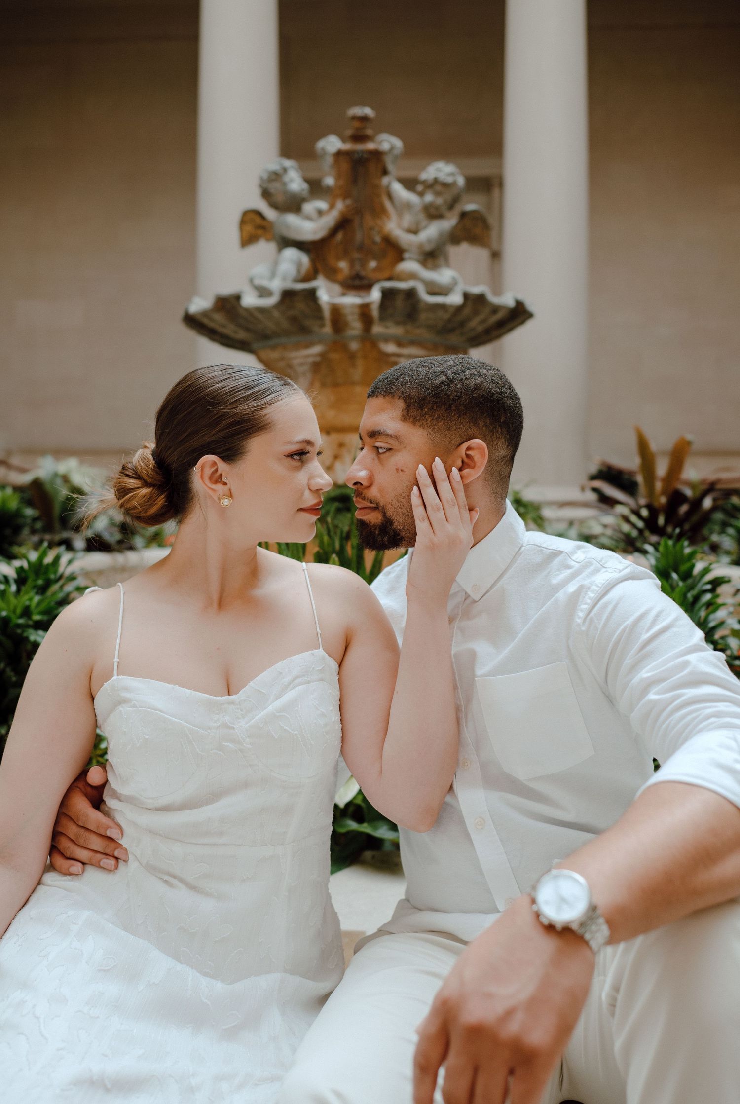 A series of romantic portraits in white attire showing an intimate embrace and tender moments in natural lighting.