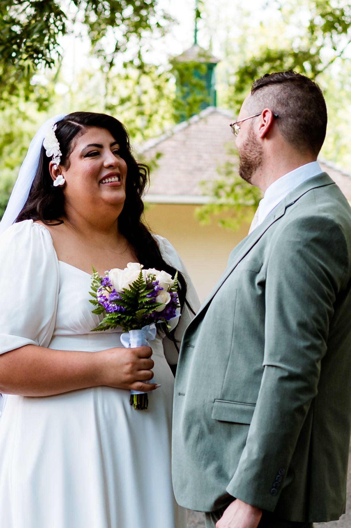 A sequence of five intimate moments between a couple in formal wedding attire sharing romantic embraces.