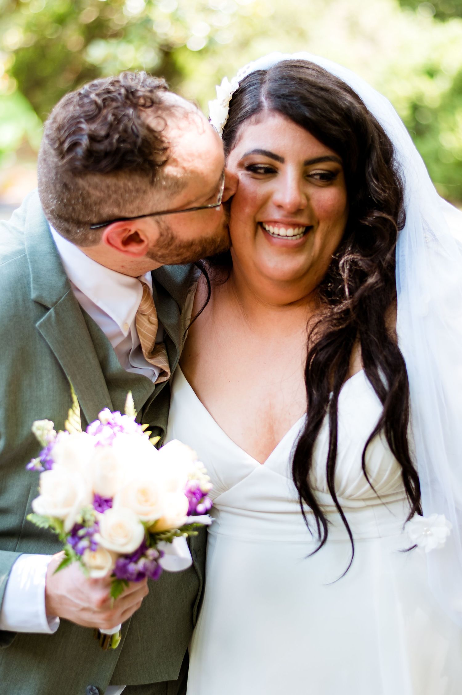 A joyful wedding couple shares intimate moments in a series of outdoor photographs with pastel floral bouquets.