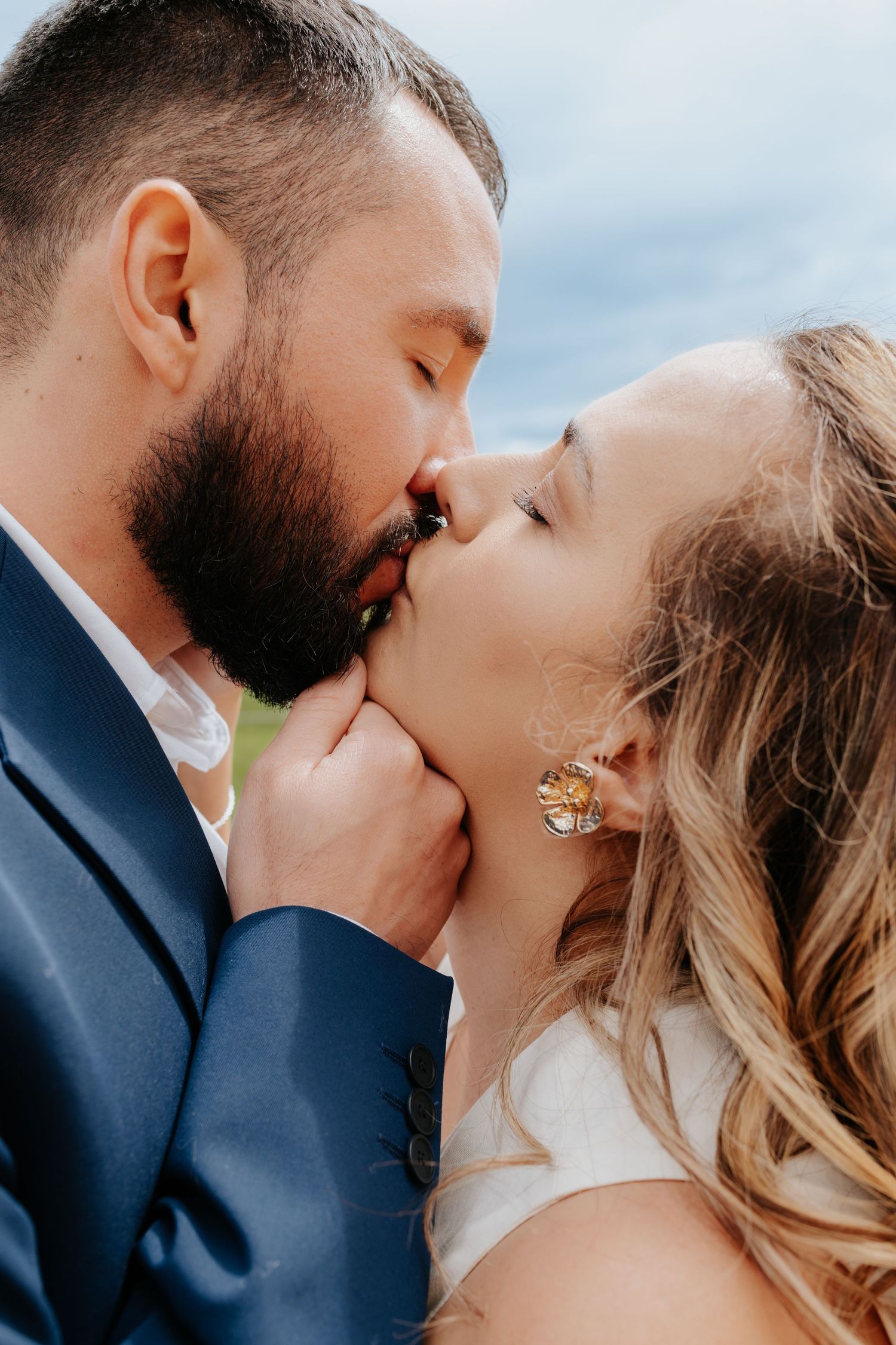 Intimate wedding photography sequence capturing romantic kisses between newlyweds.