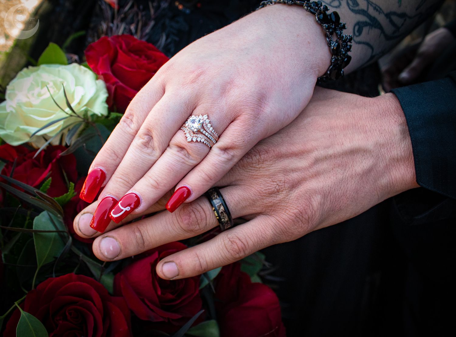 Close-up shots of hands with wedding rings resting on red and white roses.