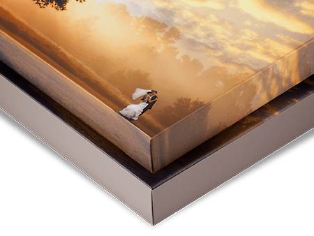 Seven stacked offset canvases displaying a dramatic orange sunset sky with dark shadows create a dimensional wall art effect.