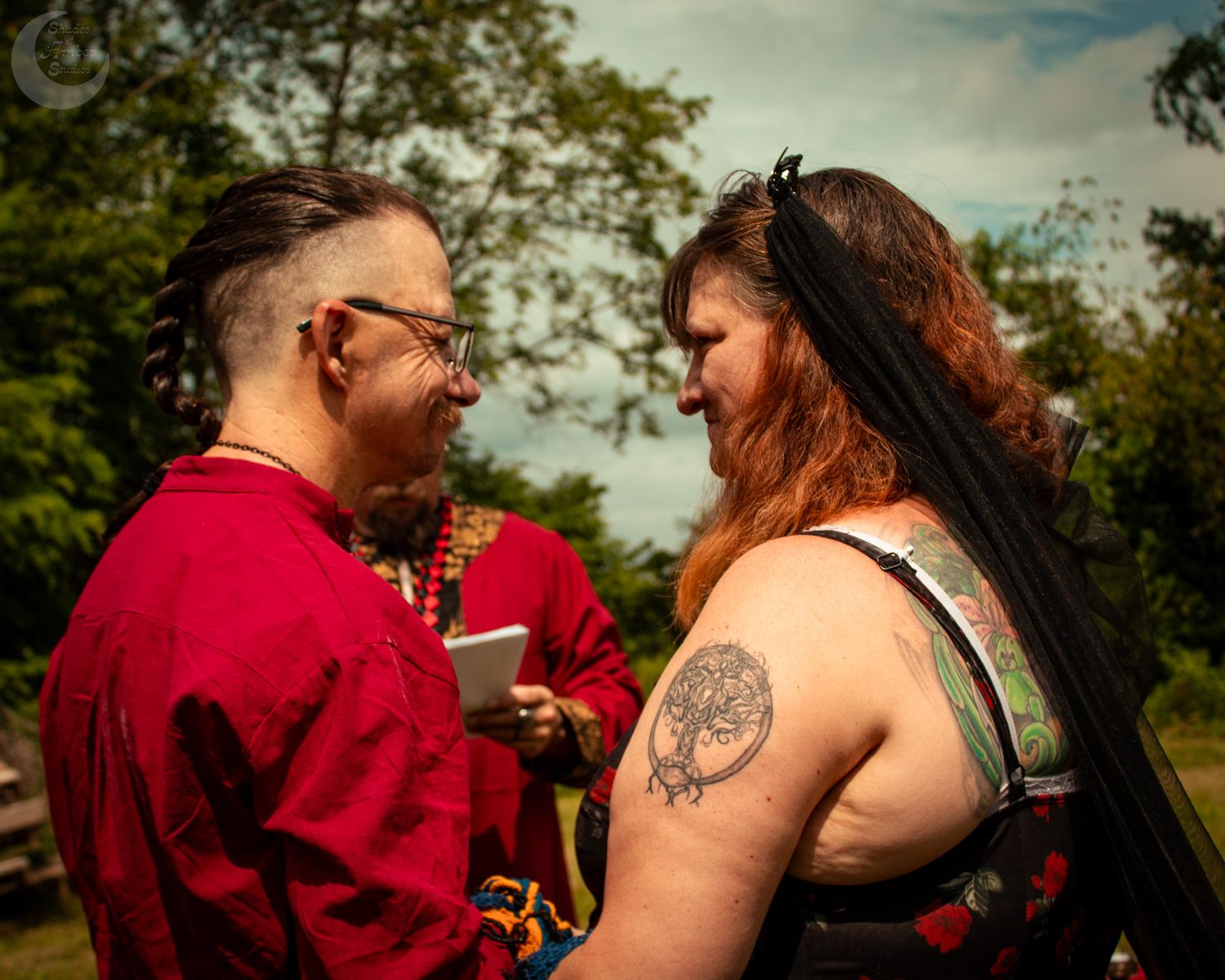 The images show a couple outdoors in red clothing embracing during what appears to be a golden hour photo session.
