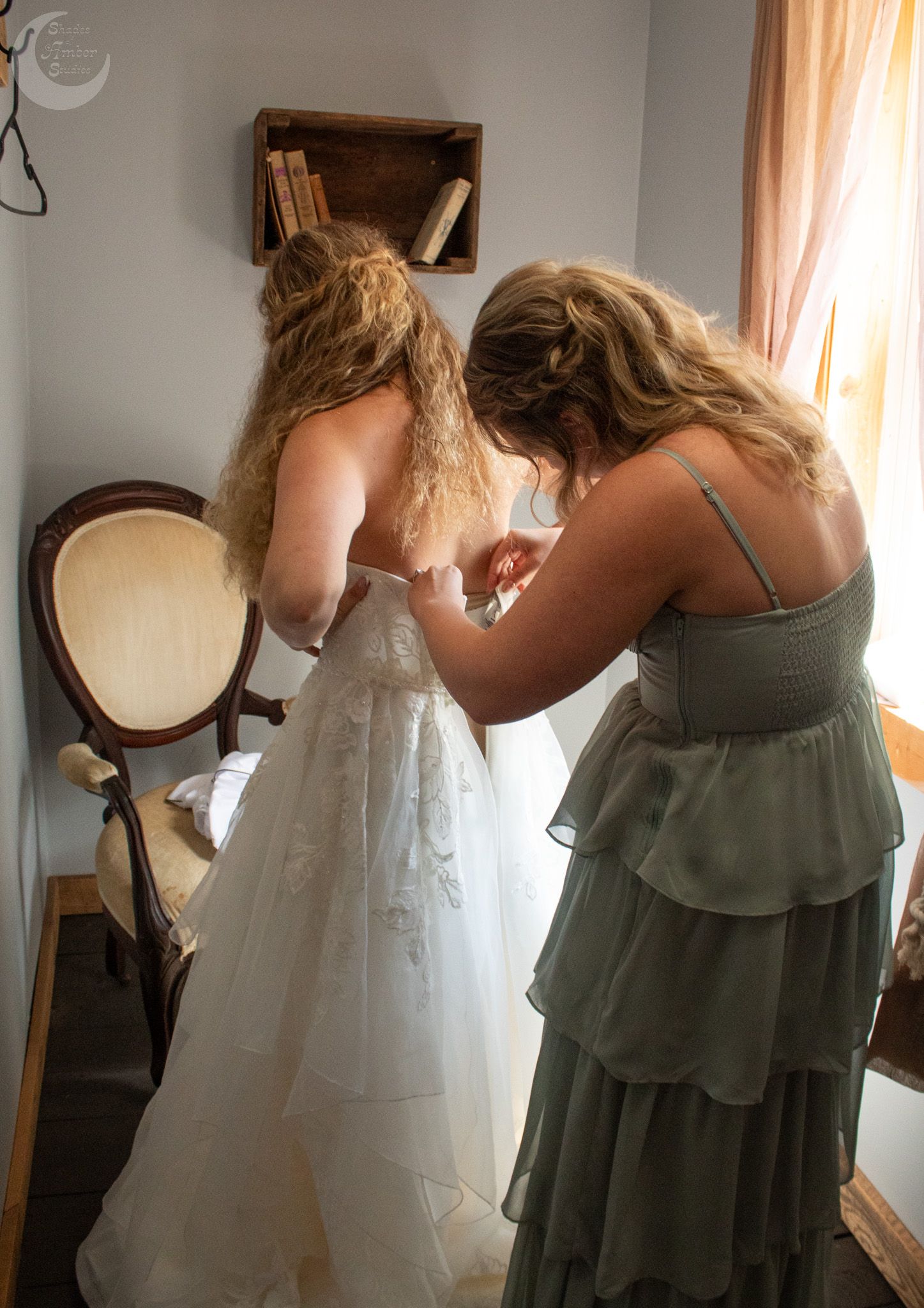 Series of images showing people helping with a white wedding dress fitting in a sunlit room.