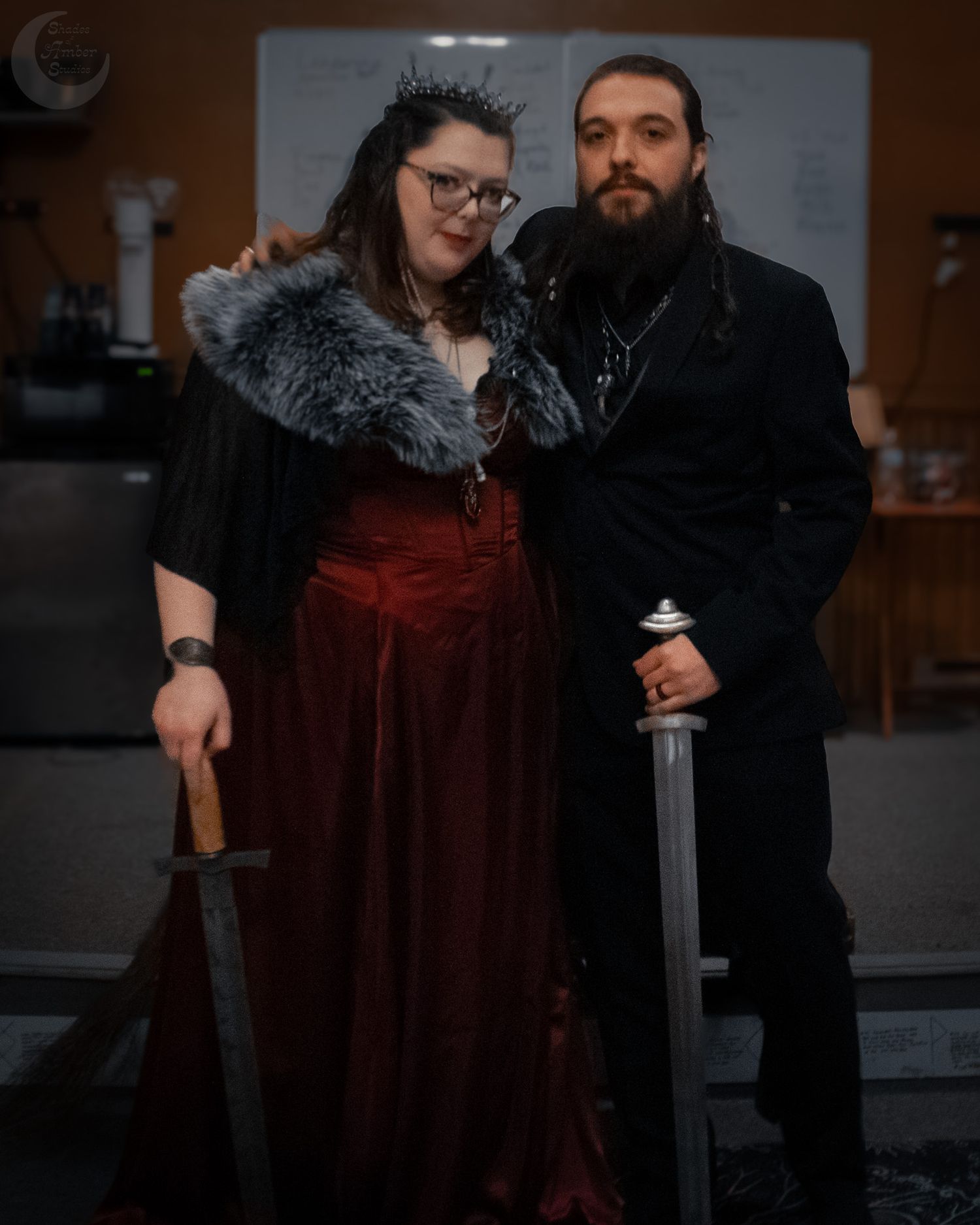 A medieval-inspired portrait featuring gothic attire, fur trim, and ceremonial accessories.