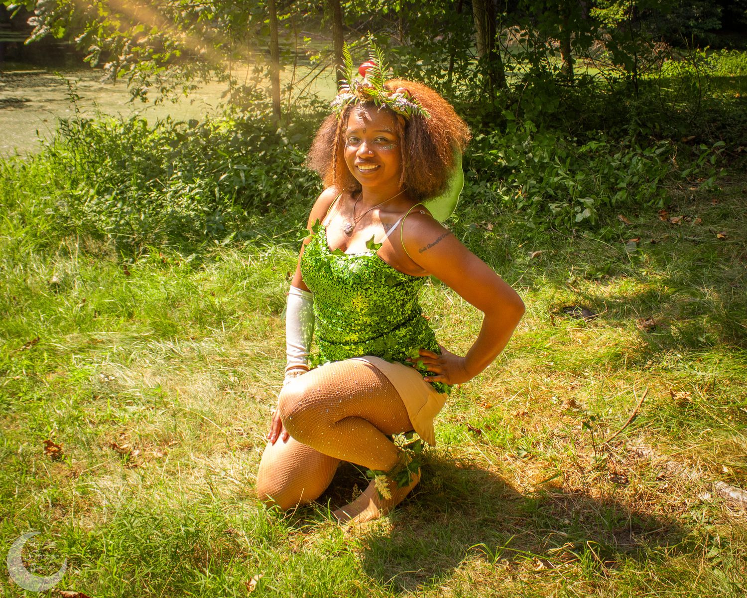 People enjoying a sunny summer photo shoot in a lush green forest setting.