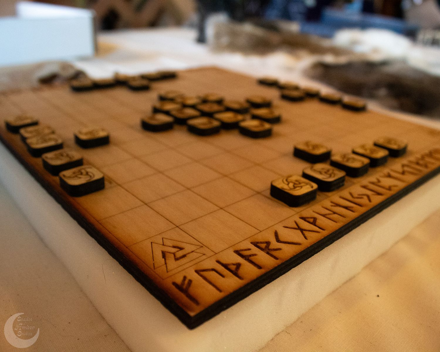 Wooden typography letters arranged on a light colored surface in warm lighting.