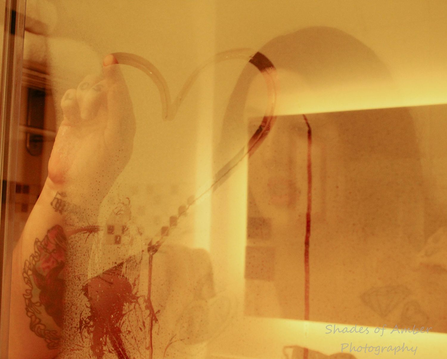 Abstract double exposure photograph with warm golden tones showing architectural elements and shadows creating a dreamy effect.