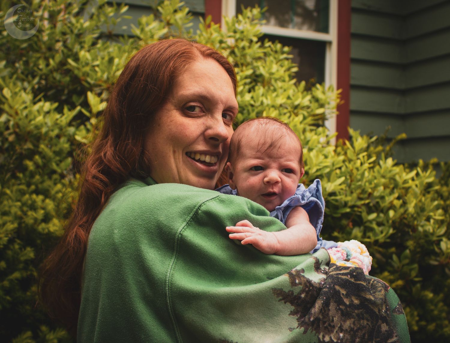 A series of progressive shots capturing a warm hug between two people in front of green foliage.