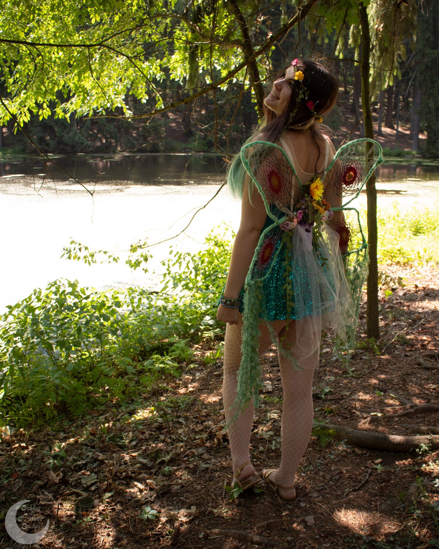 Magical woodland photography session with fairy costumes and natural scenery.