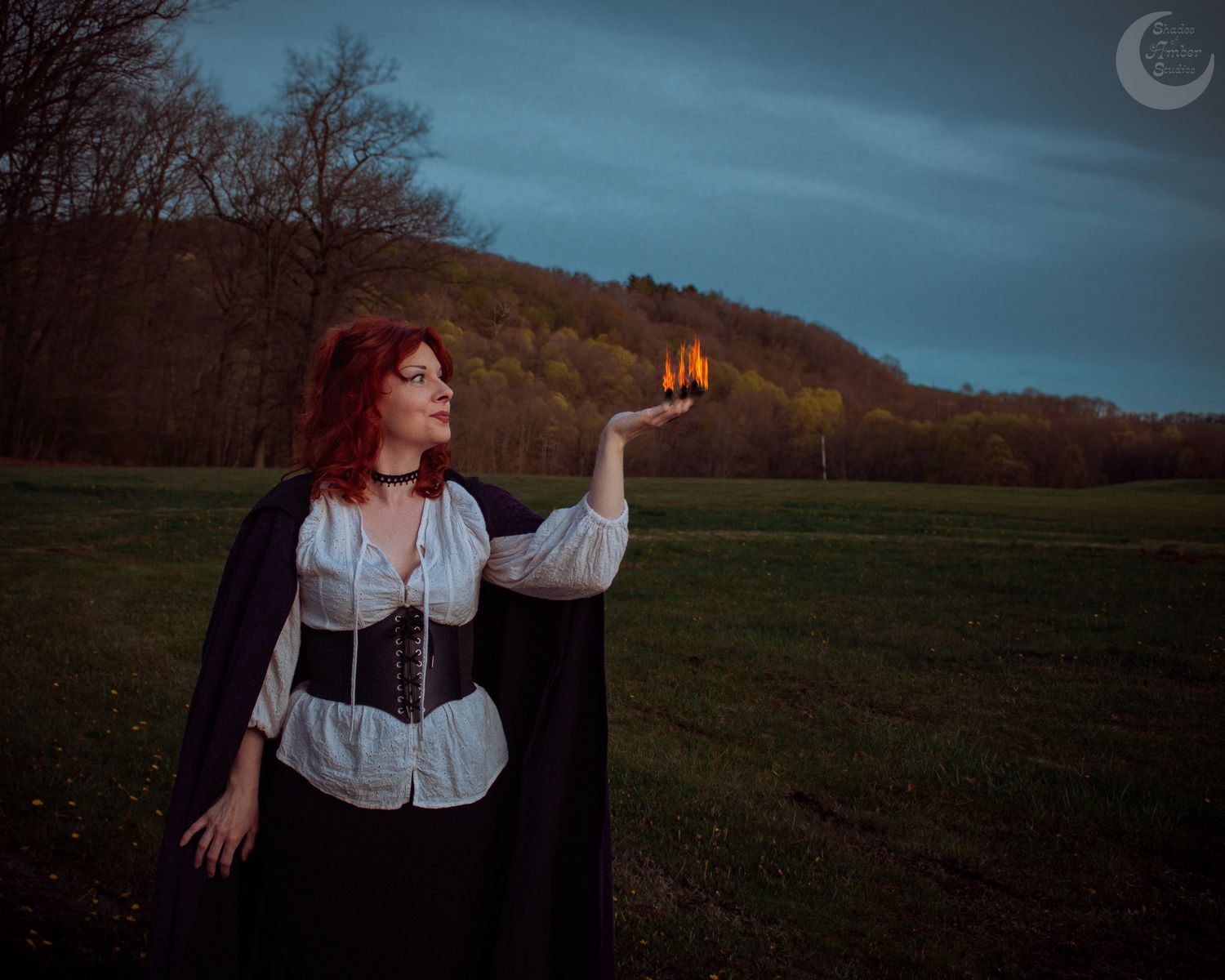 A mystical series of photographs showing a woman performing ritual movements with fire in a dark field under twilight skies.